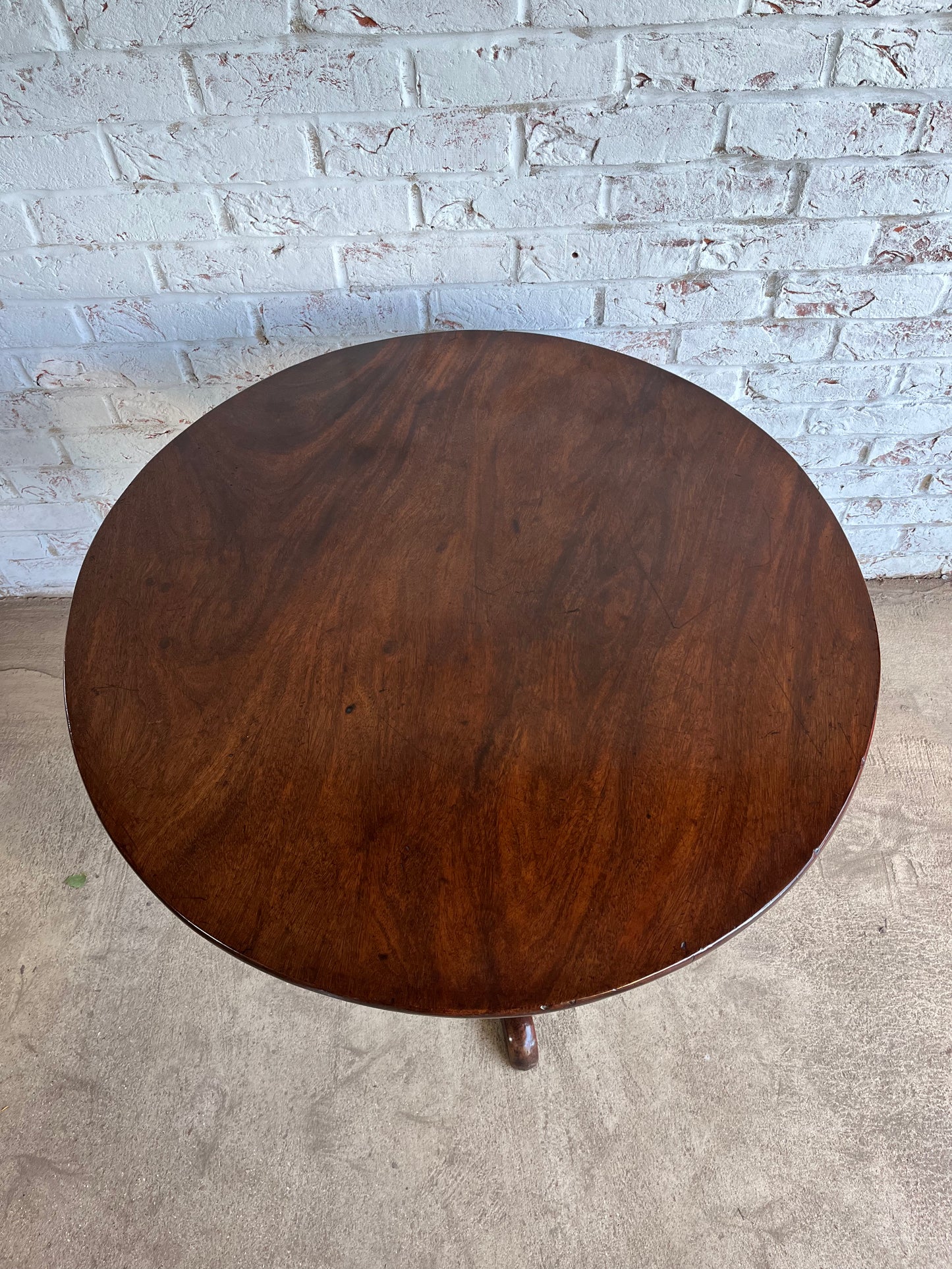 George III mahogany tilt top tripod table.