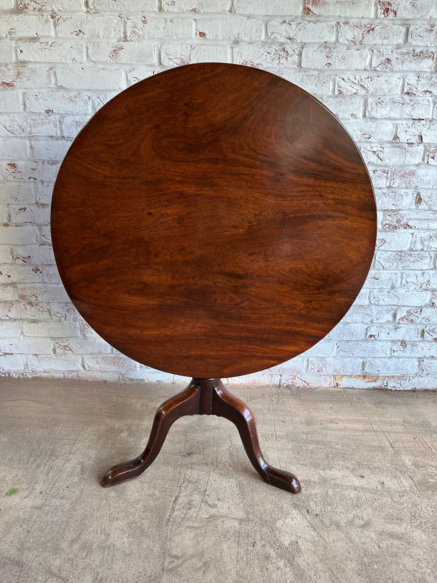 George III mahogany tilt top tripod table.
