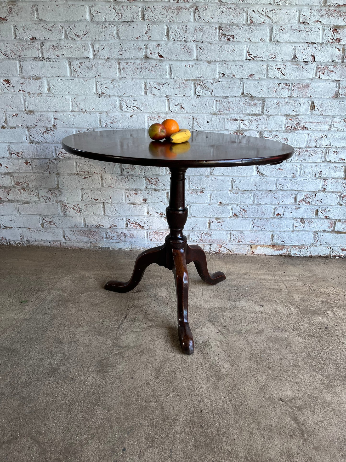 George III mahogany tilt top tripod table.
