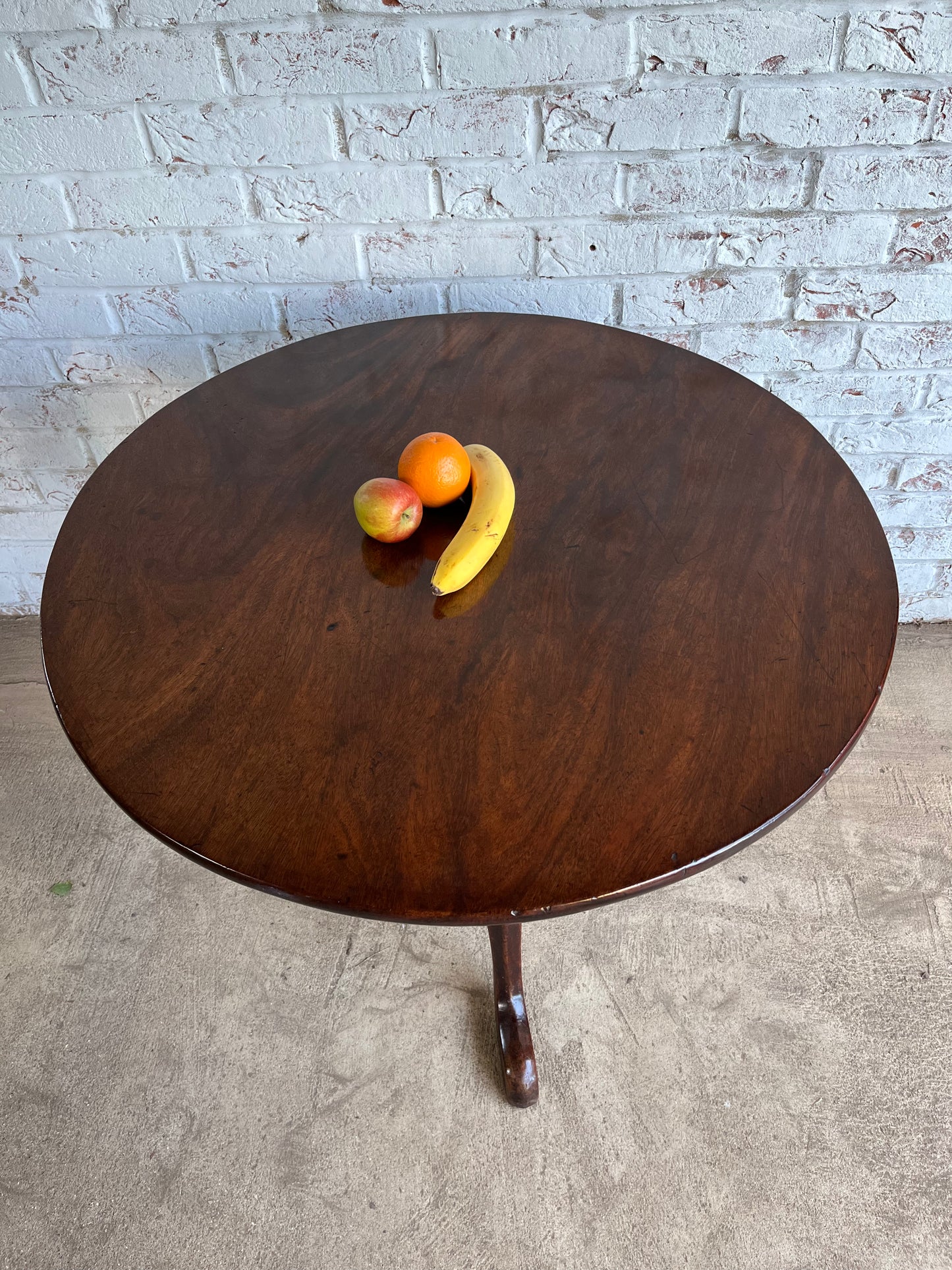 George III mahogany tilt top tripod table.