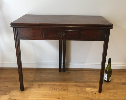 George III mahogany fold-over tea table