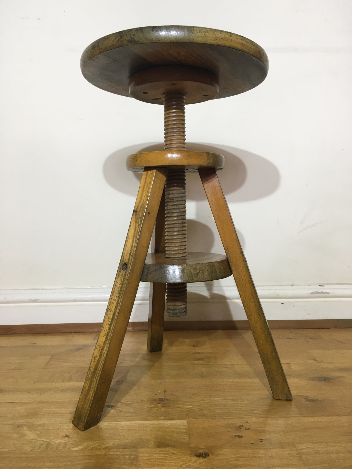 Vintage adjustable wooden artist's or potter's stool.
