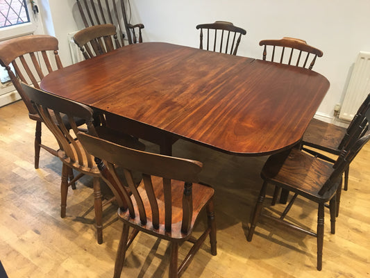 A fine, large George III mahogany drop-leaf dining table, with excellent provenance.