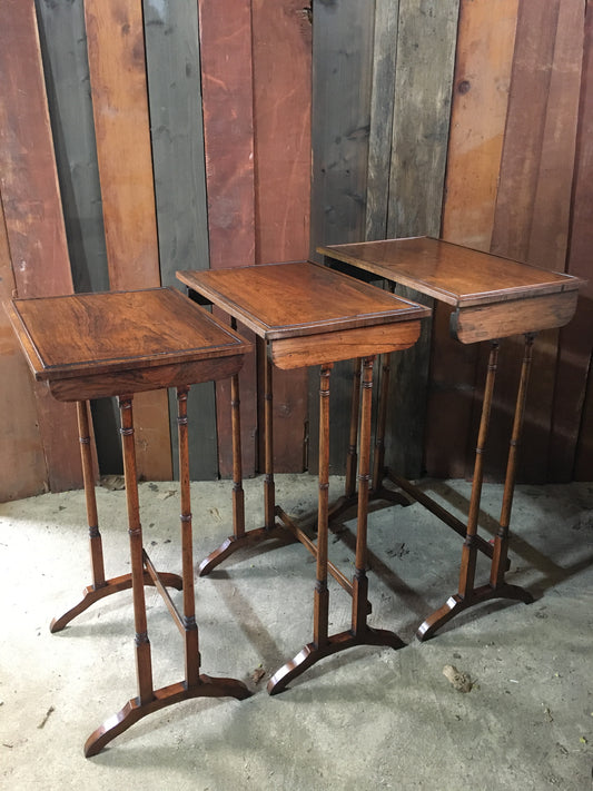 A nest of three late Regency rosewood tables.