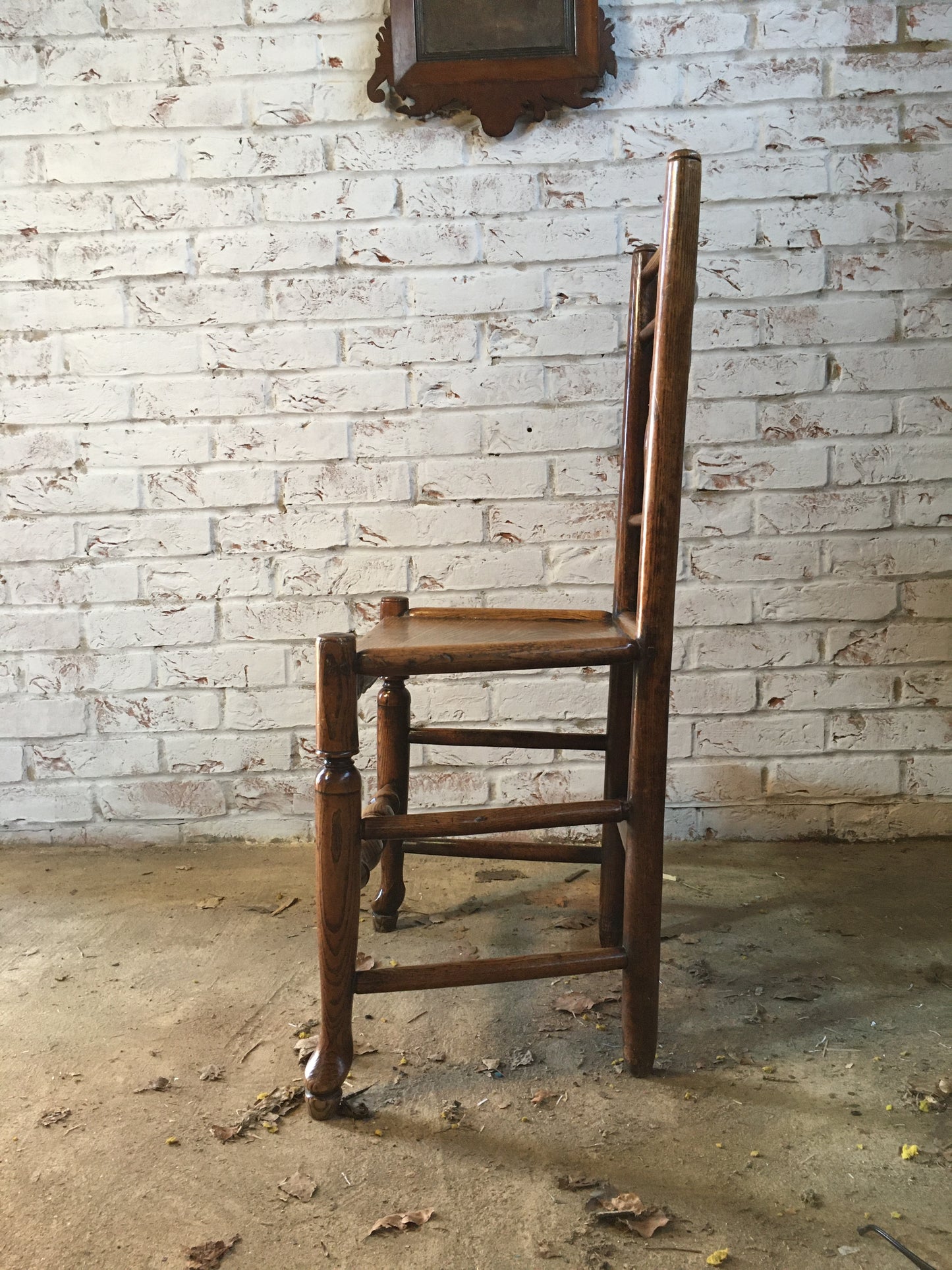 Early 19th century (or earlier) spindle-back side chair.