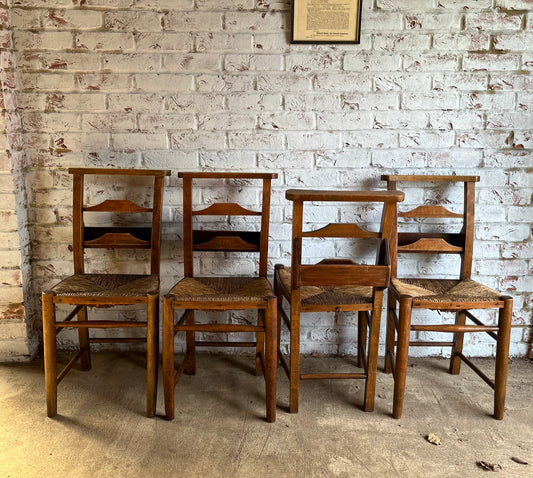 Set of four rustic early 20th century ladder back chapel chairs.