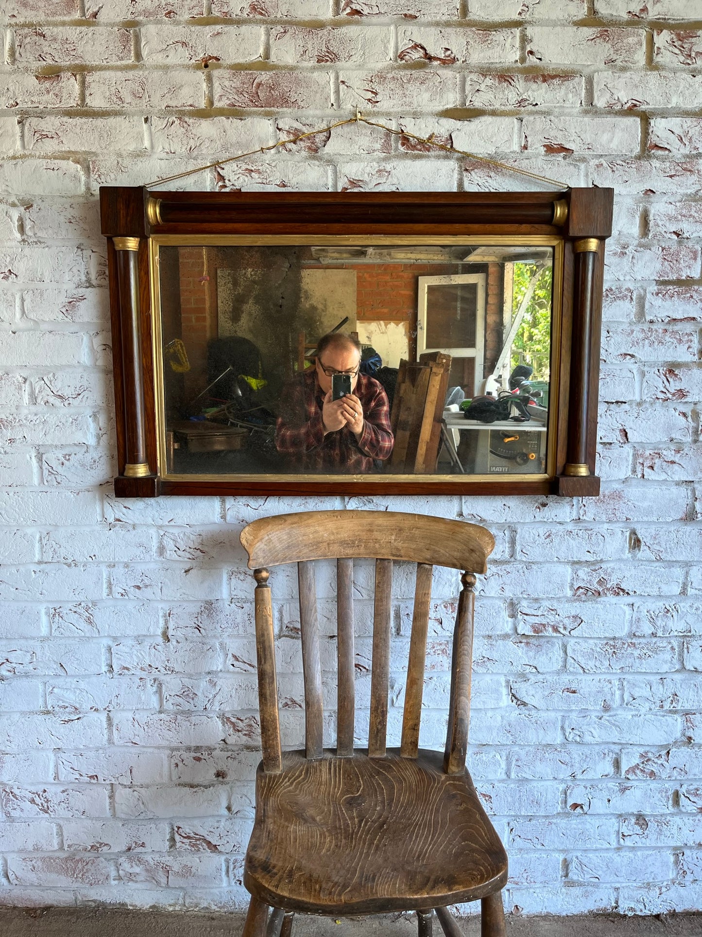 Regency rosewood and gilt overmantel or wall mirror with original foxed plate.