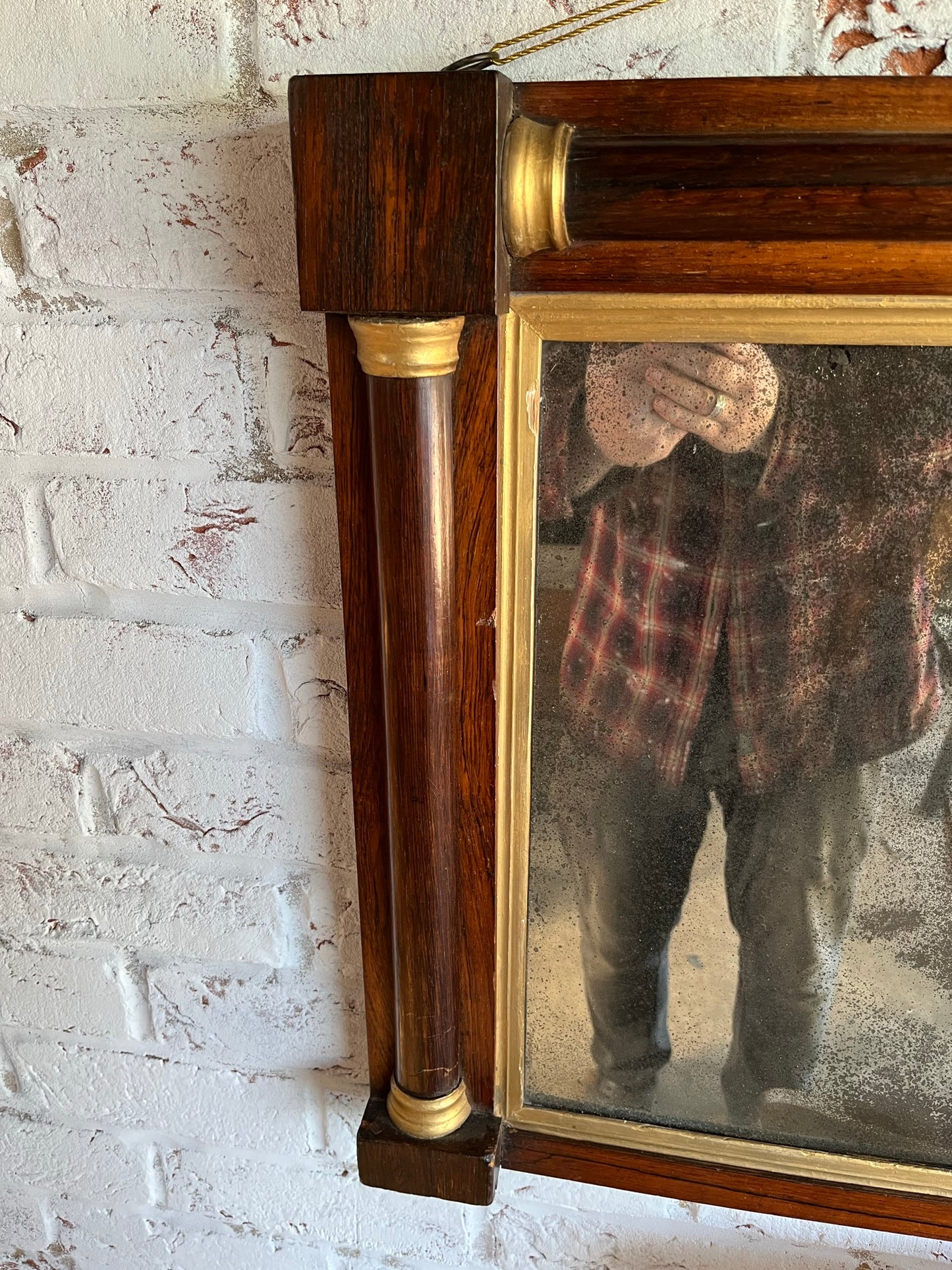 Regency rosewood and gilt overmantel or wall mirror with original foxed plate.