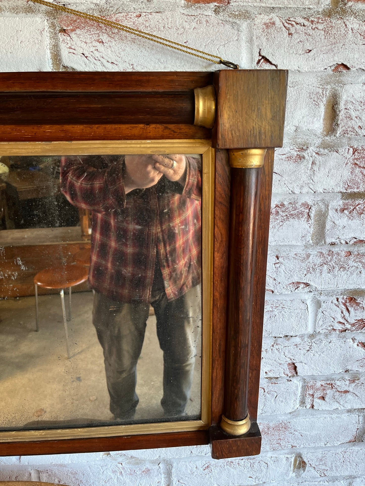 Regency rosewood and gilt overmantel or wall mirror with original foxed plate.