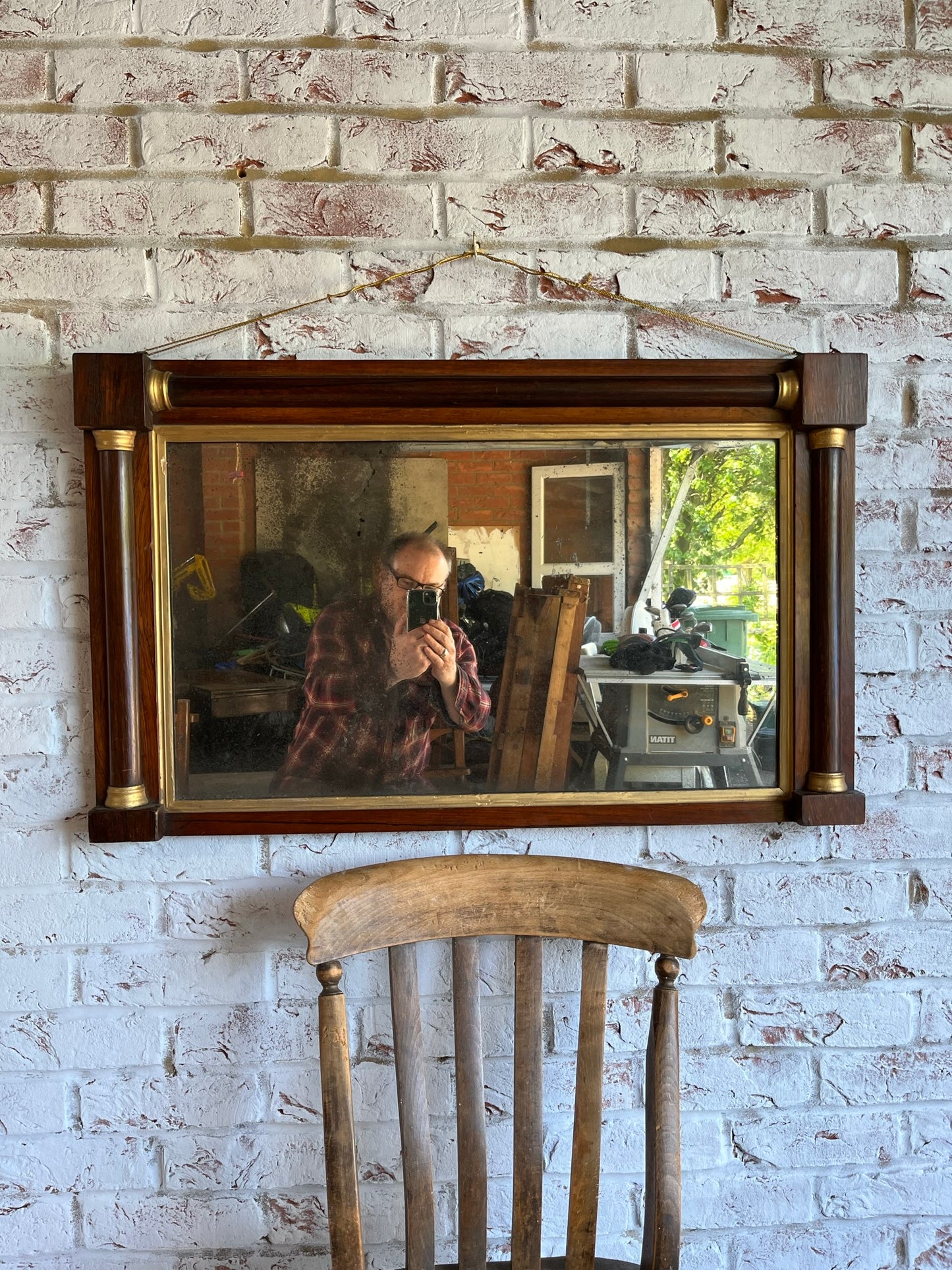 Regency rosewood and gilt overmantel or wall mirror with original foxed plate.