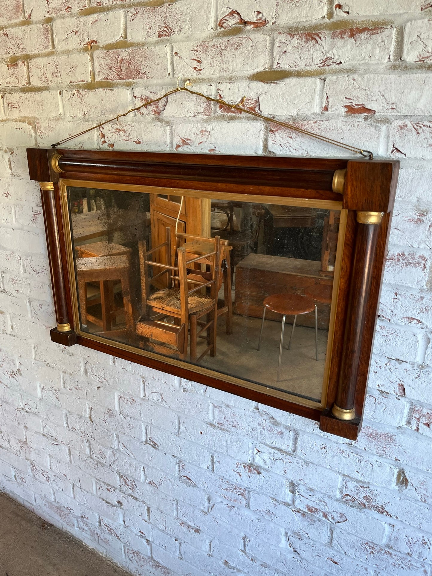 Regency rosewood and gilt overmantel or wall mirror with original foxed plate.