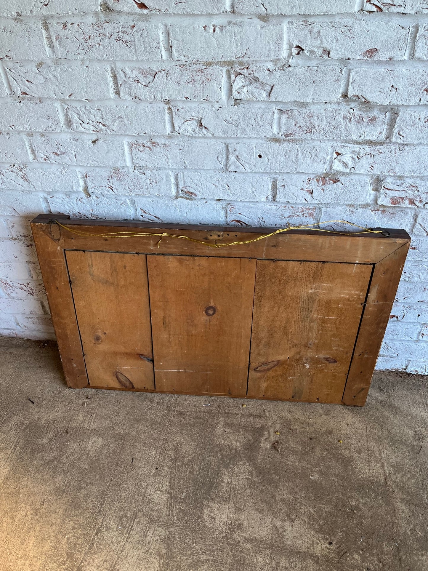 Regency rosewood and gilt overmantel or wall mirror with original foxed plate.