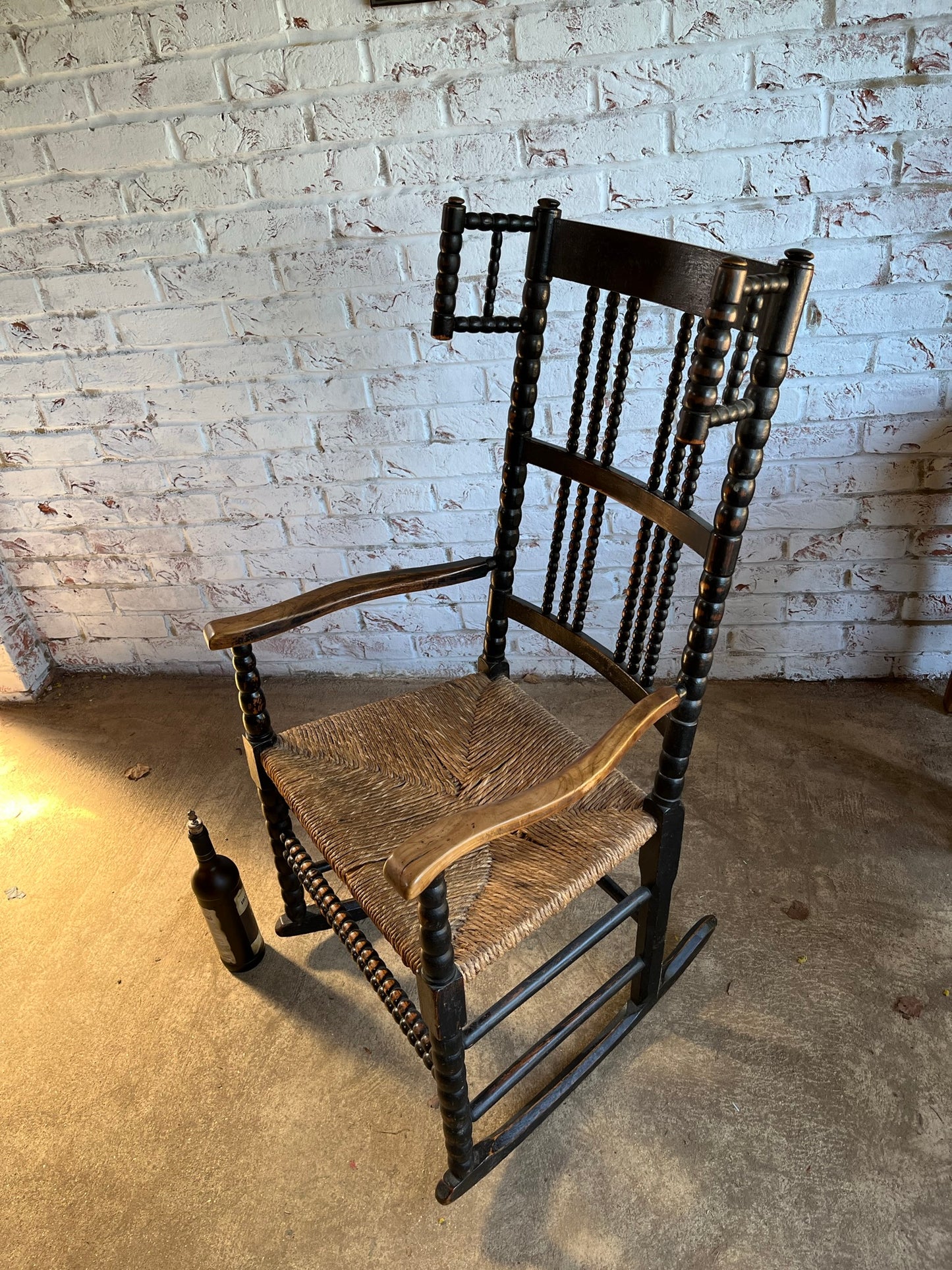 Arts and Crafts bobbin-turned rocking chair, in the style of Ernest Gimson, circa 1900-1910.