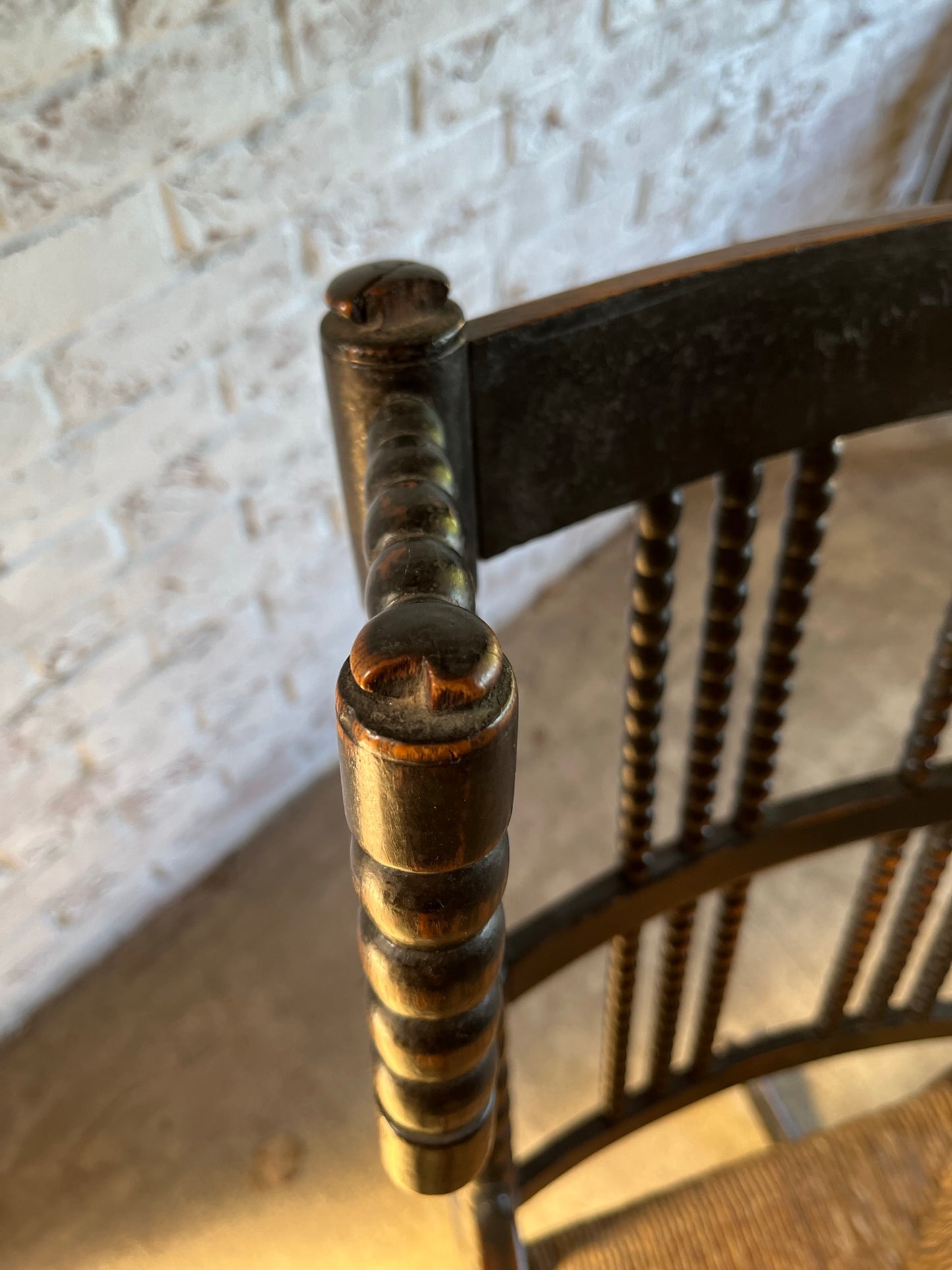 Arts and Crafts bobbin-turned rocking chair, in the style of Ernest Gimson, circa 1900-1910.