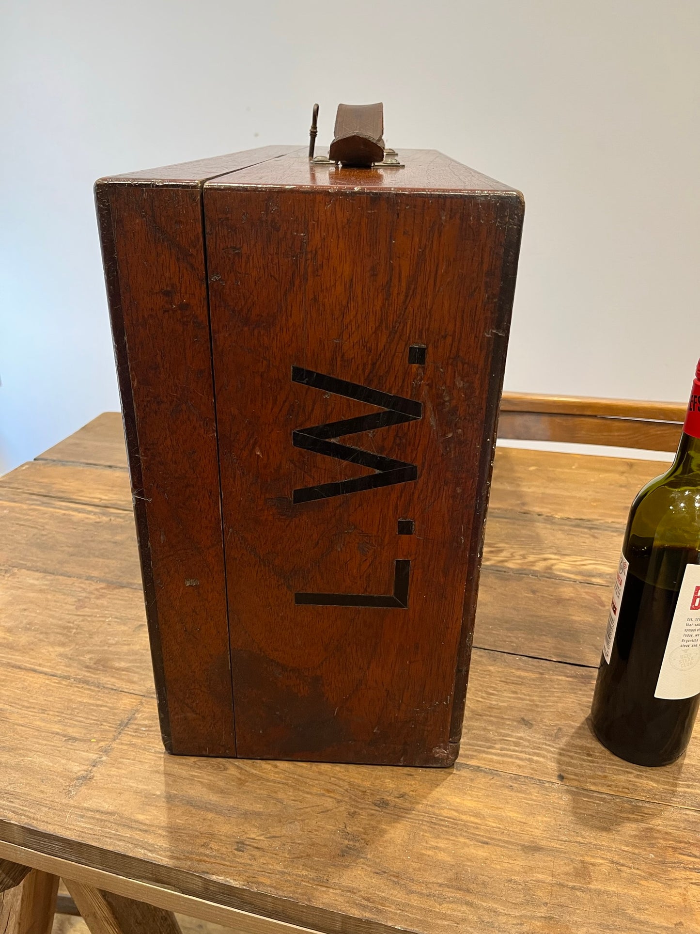Intriguing early 20th century walnut case with key and Spanish tickets/leaflets lining.