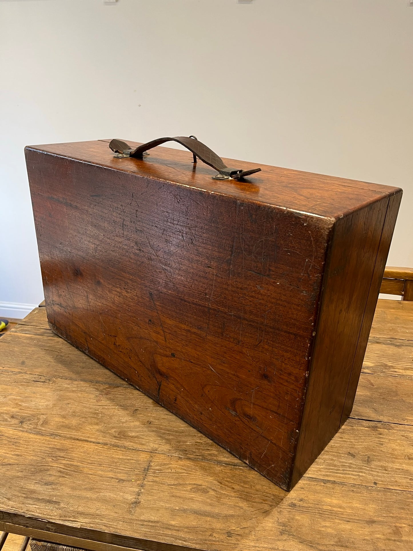 Intriguing early 20th century walnut case with key and Spanish tickets/leaflets lining.