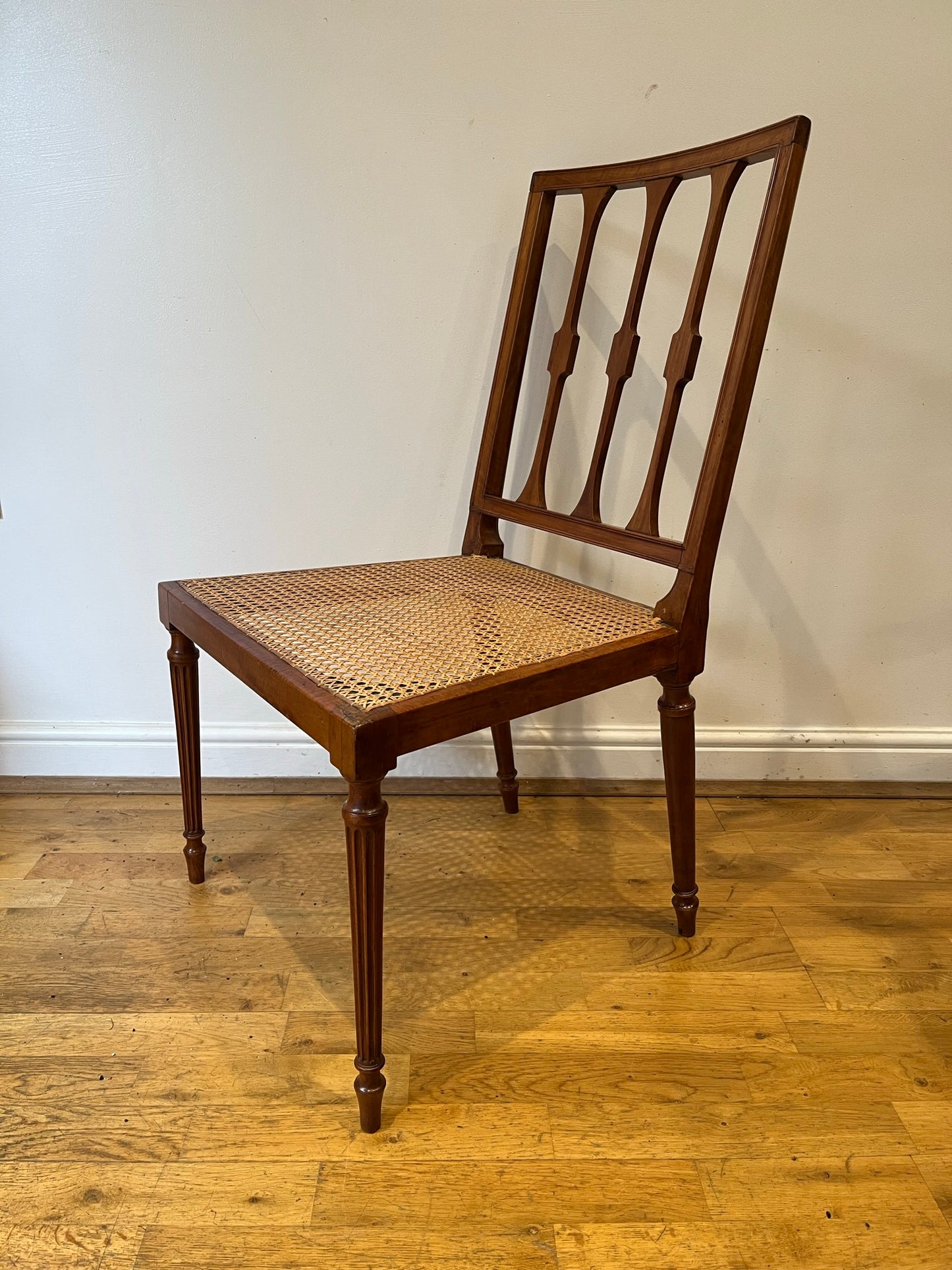 Fine cane-seated chair from Brudenell House, Bucks, in the manner of Gillows.
