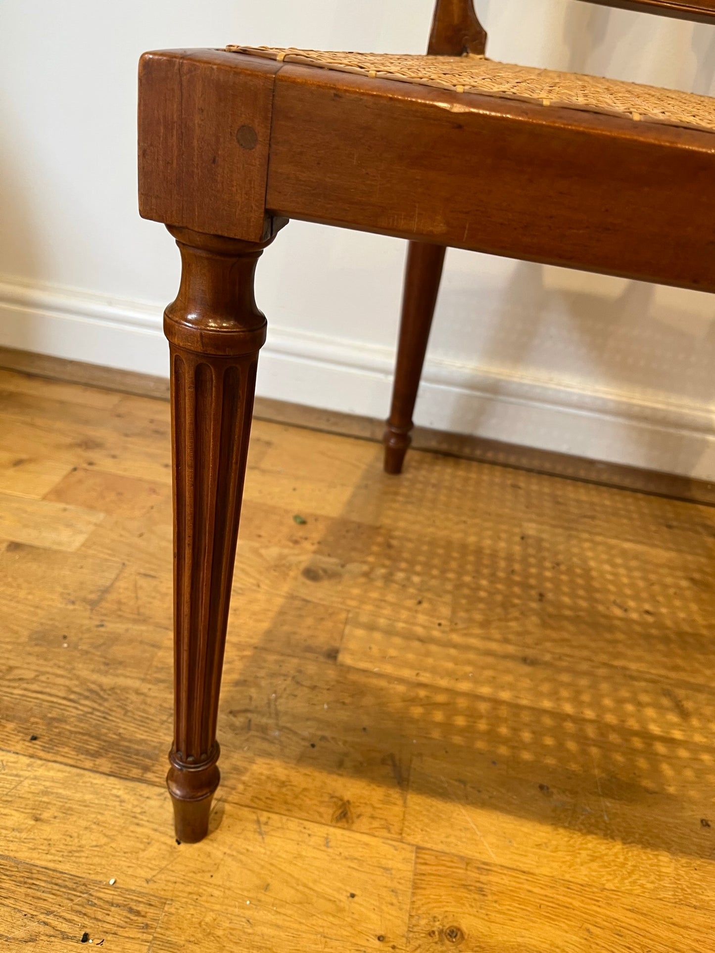 Fine cane-seated chair from Brudenell House, Bucks, in the manner of Gillows.