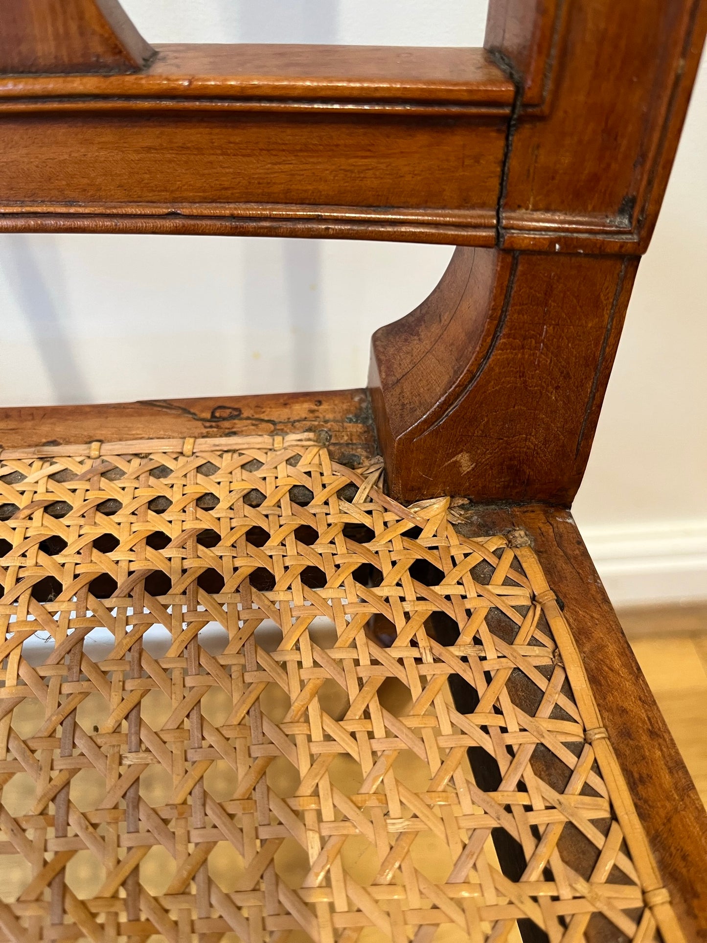 Fine cane-seated chair from Brudenell House, Bucks, in the manner of Gillows.