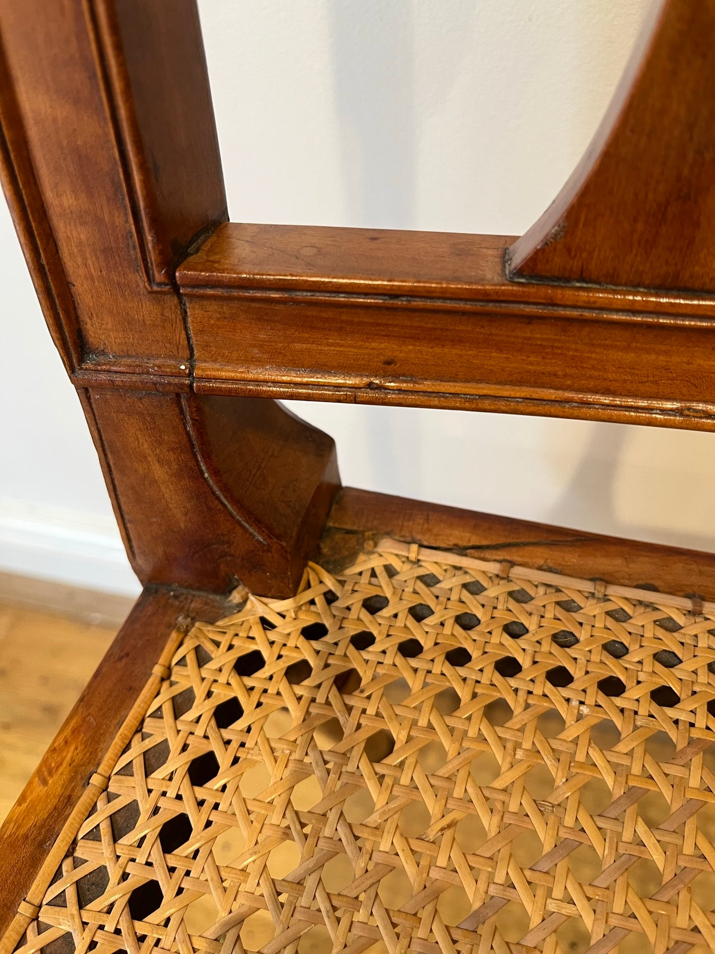 Fine cane-seated chair from Brudenell House, Bucks, in the manner of Gillows.