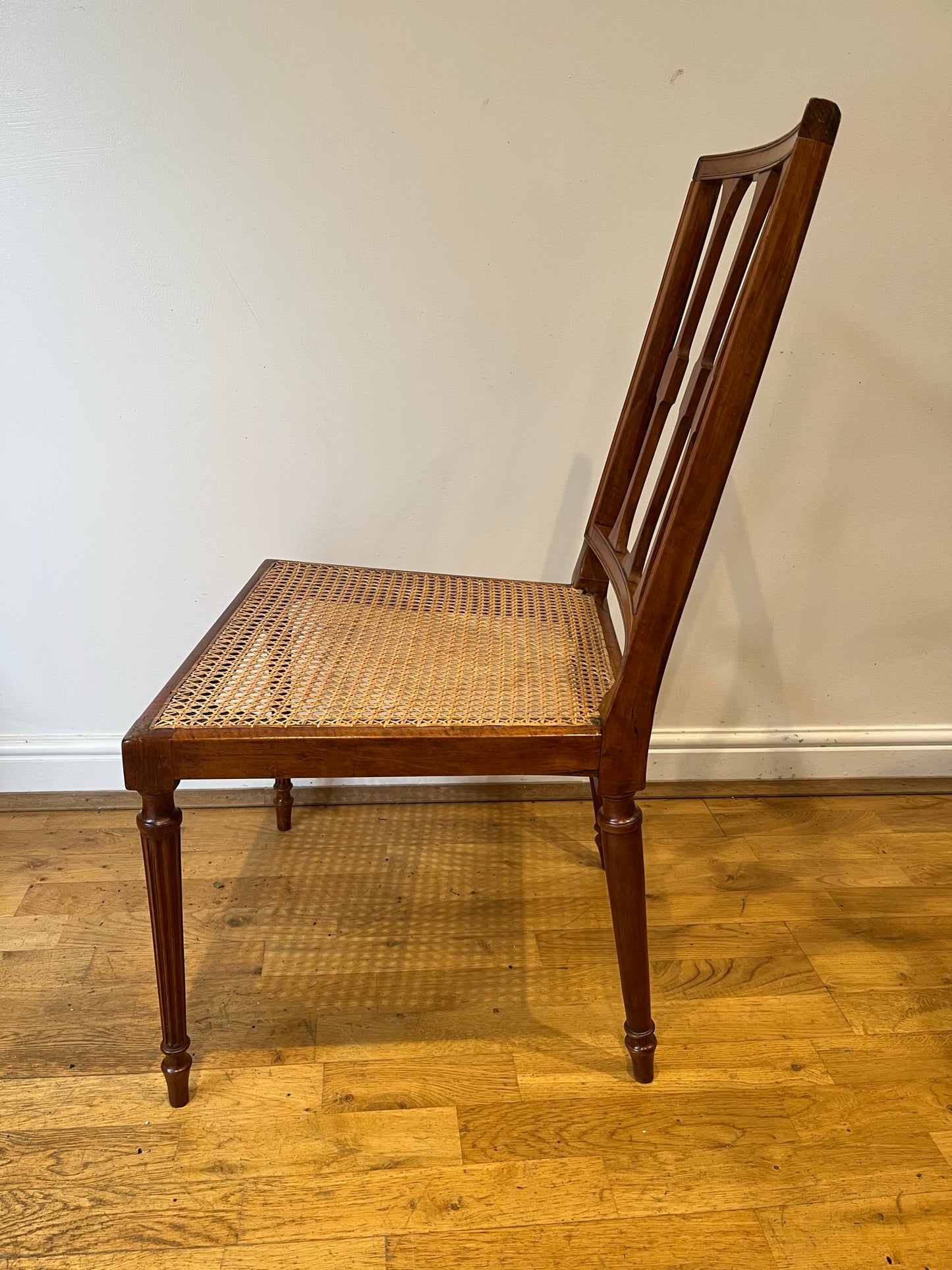 Fine cane-seated chair from Brudenell House, Bucks, in the manner of Gillows.