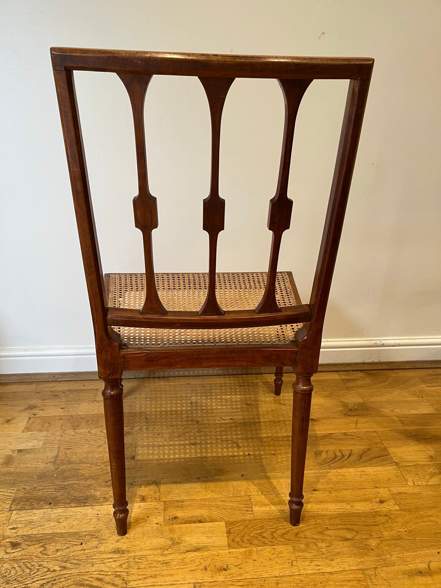 Fine cane-seated chair from Brudenell House, Bucks, in the manner of Gillows.