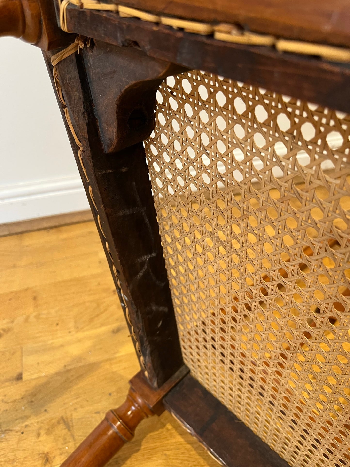Fine cane-seated chair from Brudenell House, Bucks, in the manner of Gillows.