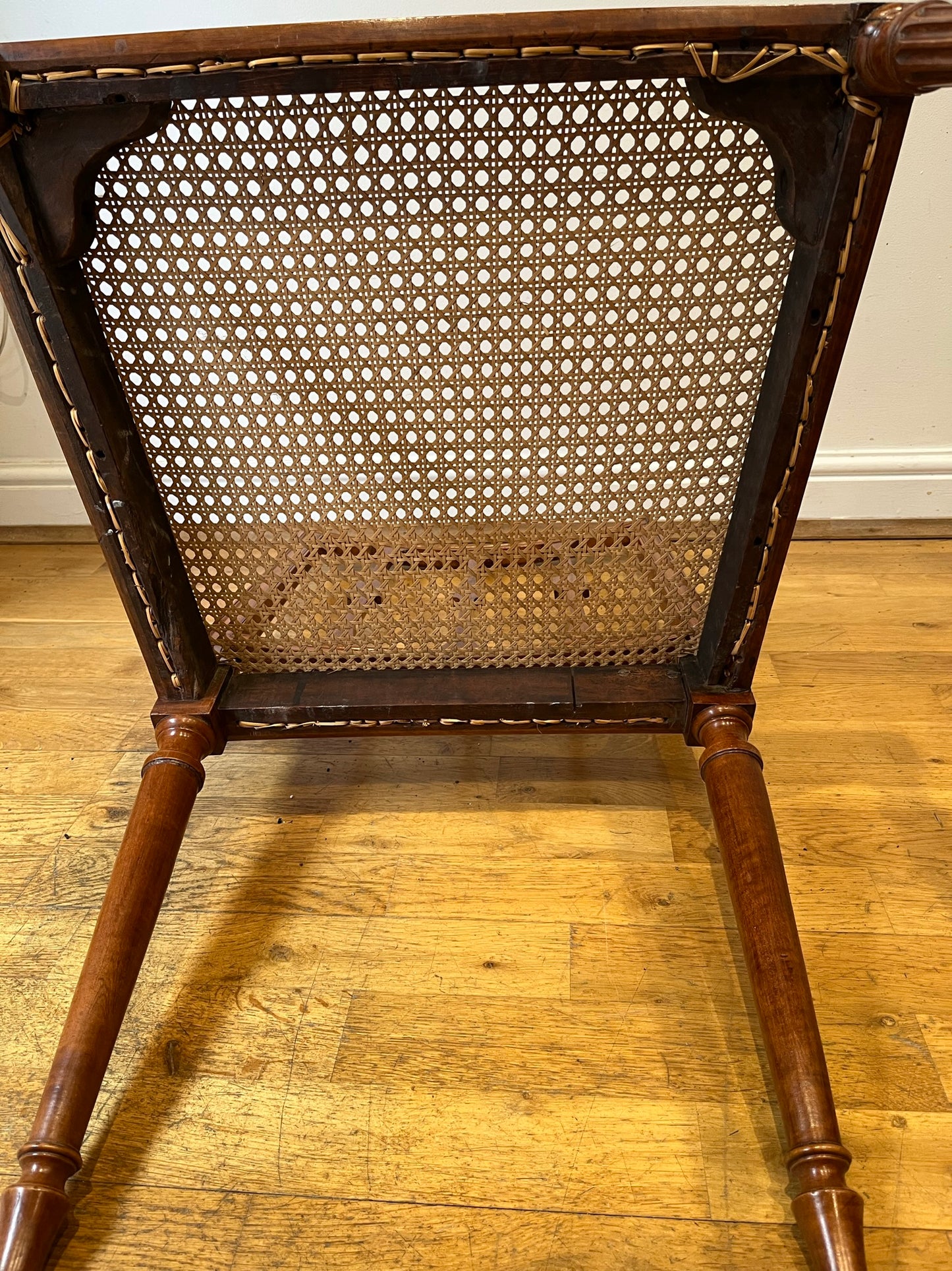 Fine cane-seated chair from Brudenell House, Bucks, in the manner of Gillows.
