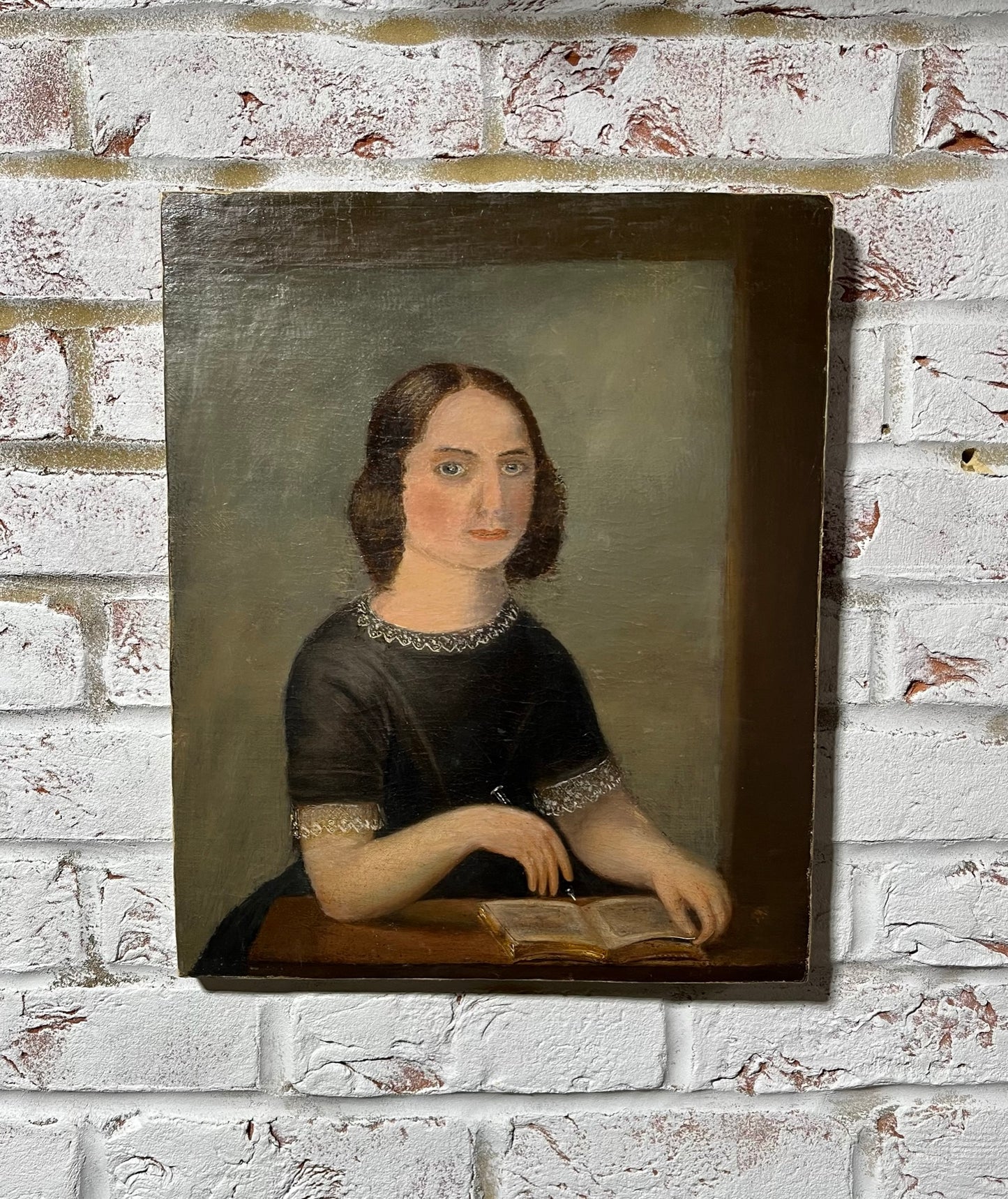 Late 19th century naïve oil painting of seated lady.