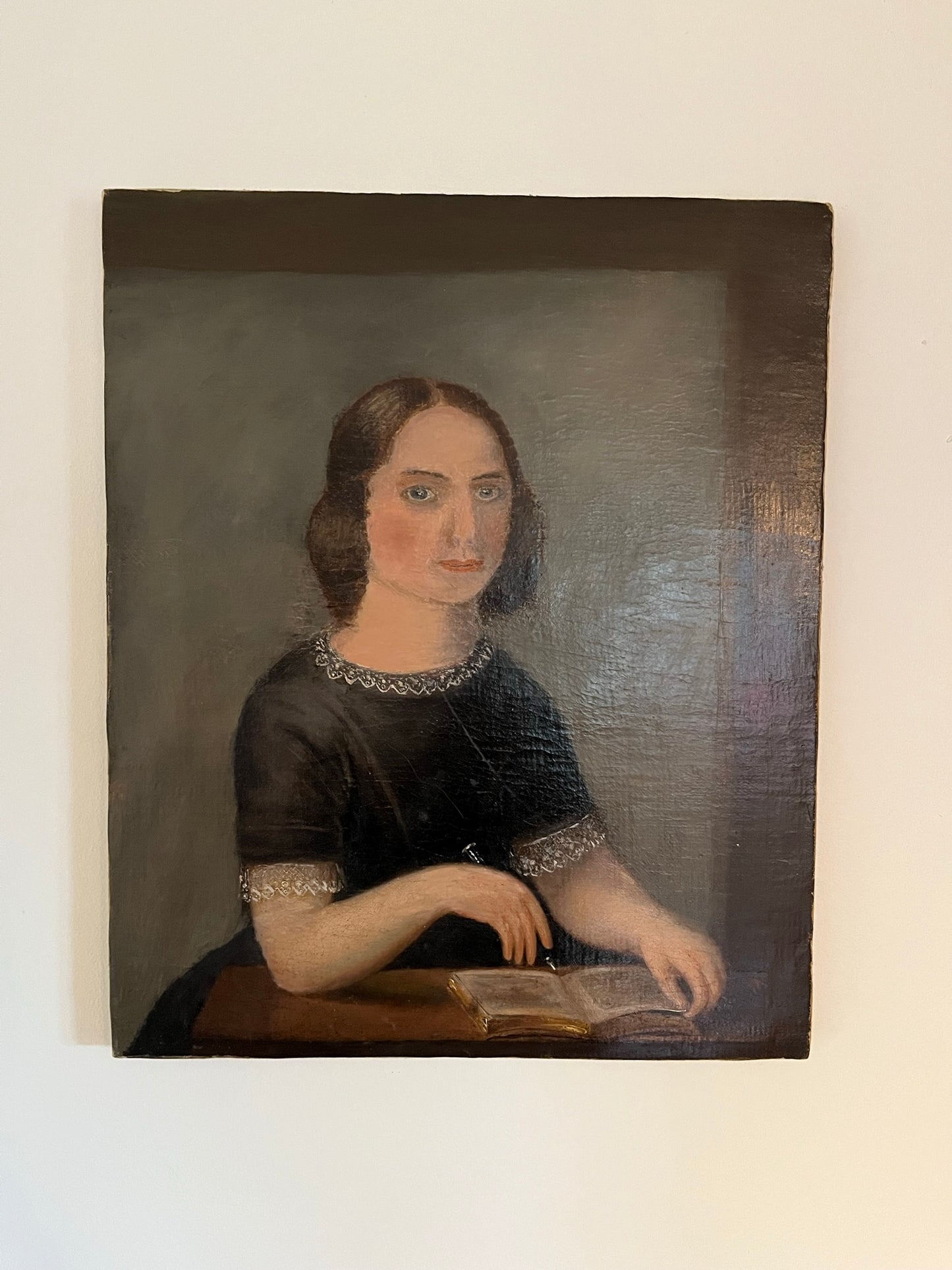Late 19th century naïve oil painting of seated lady.