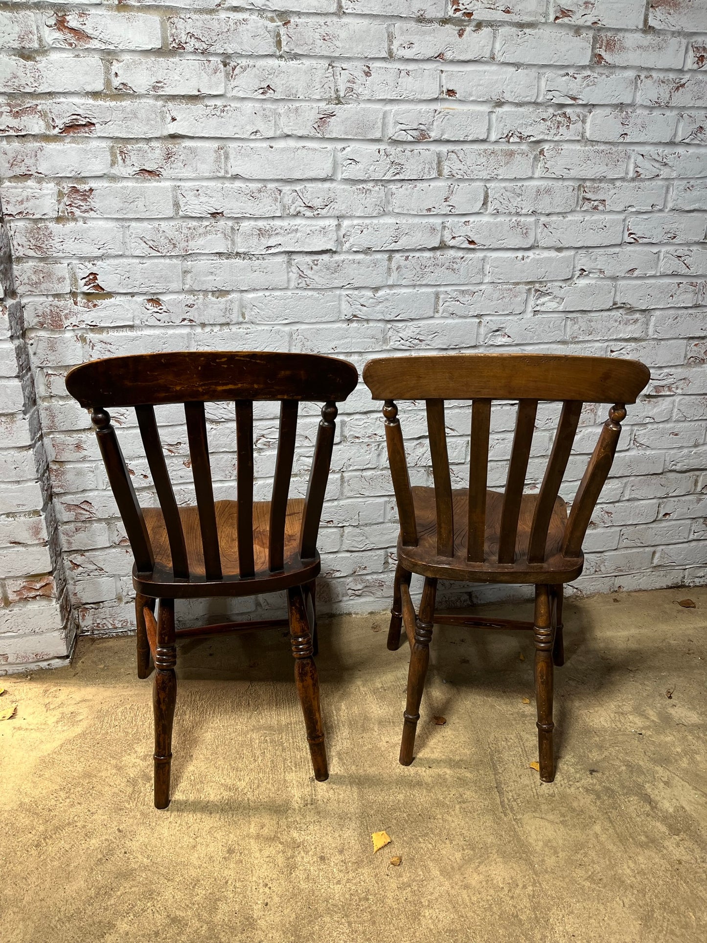 Near pair of Victorian elm slat back Windsor kitchen chairs.