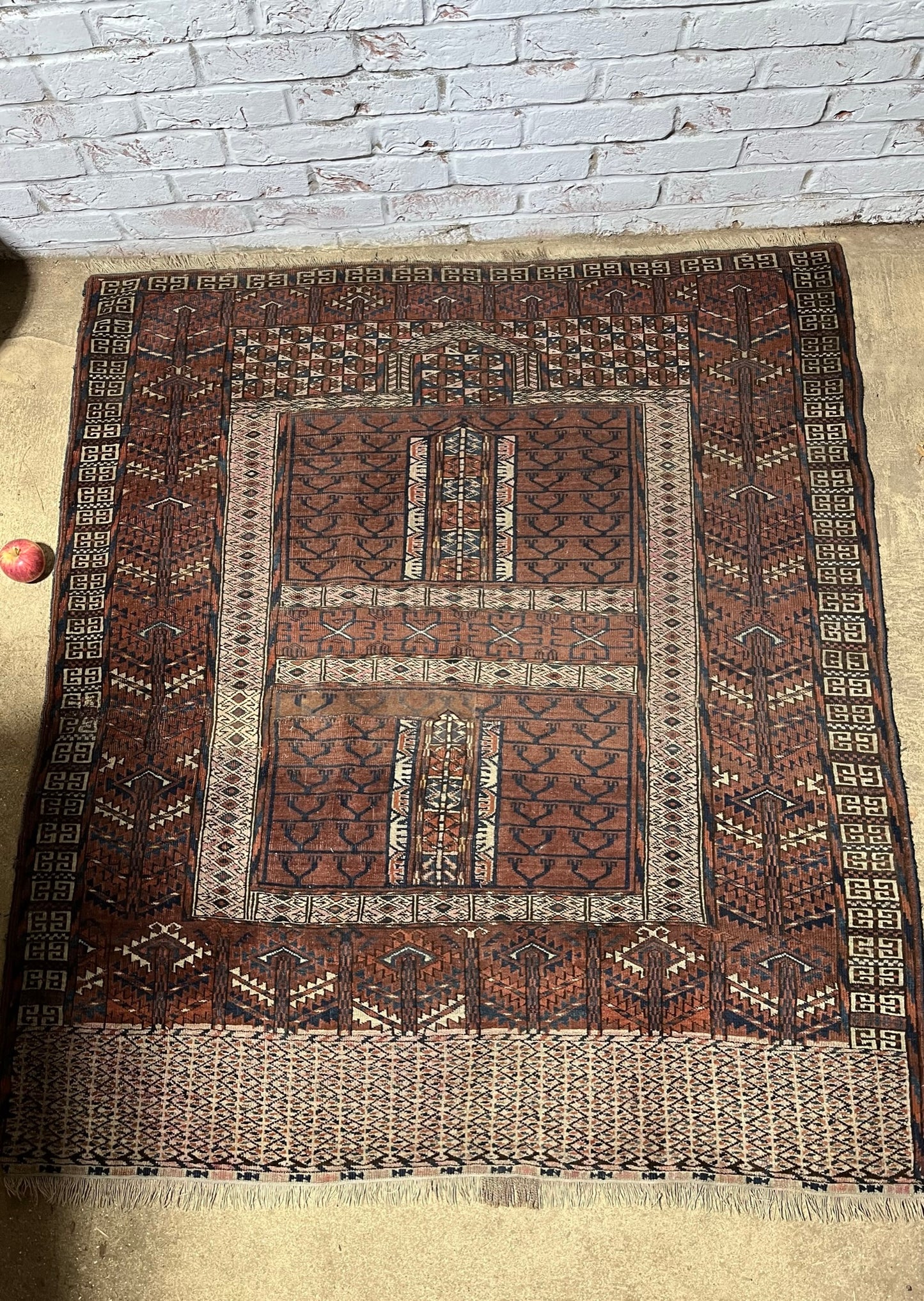An antique hatchli bokhara rug or door hanging.