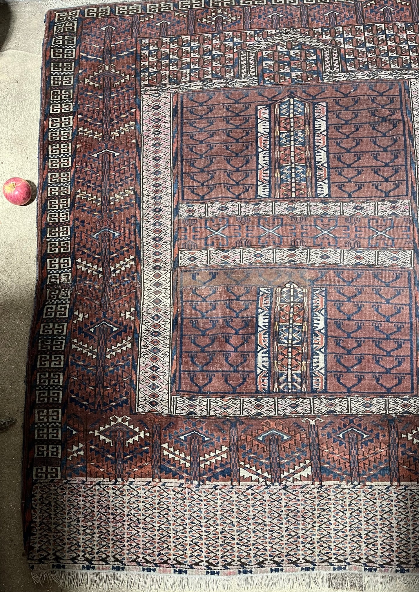 An antique hatchli bokhara rug or door hanging.