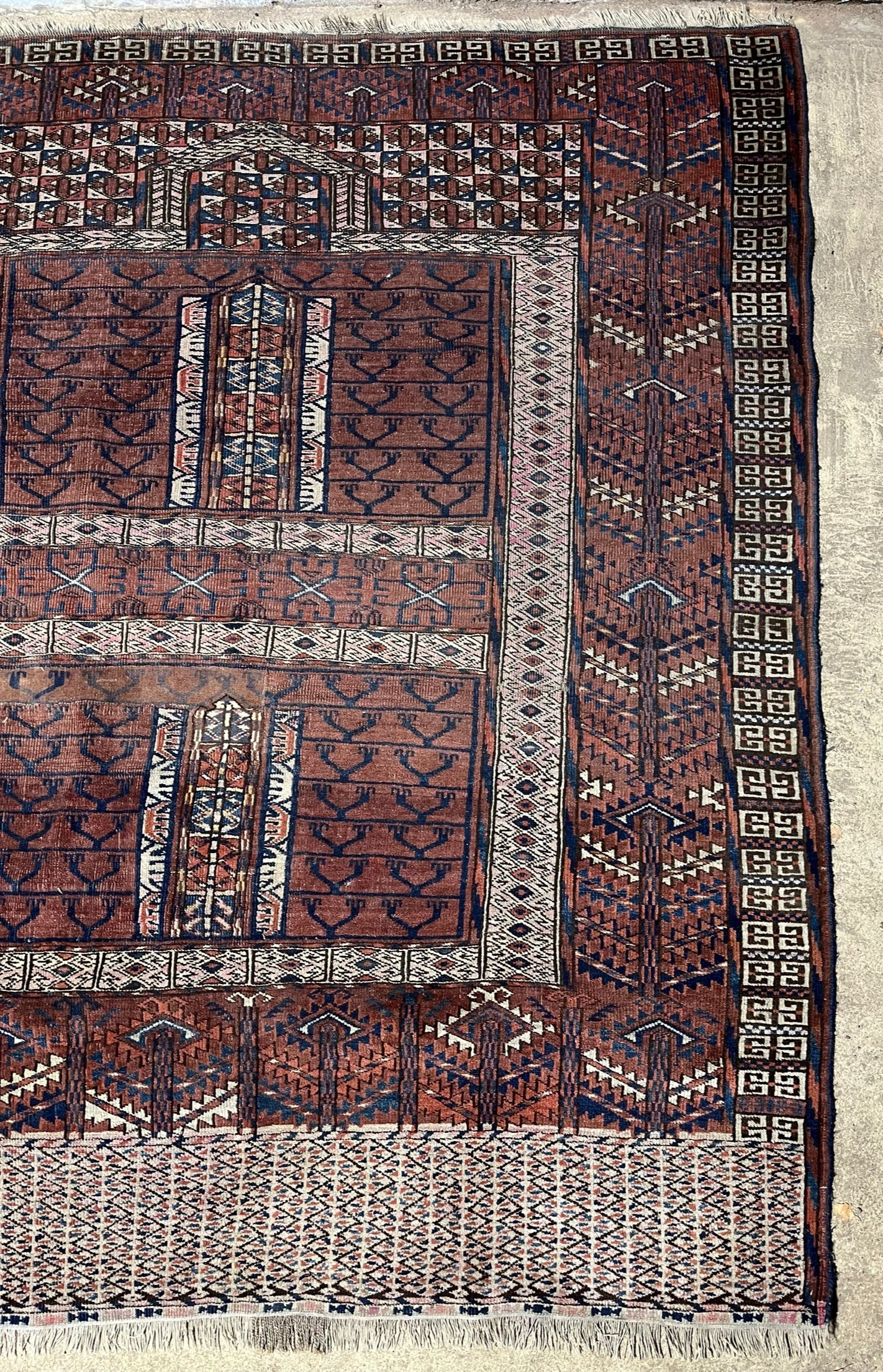 An antique hatchli bokhara rug or door hanging.