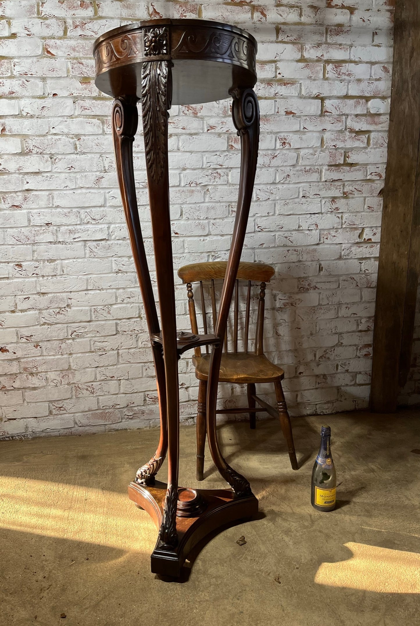 A very large mahogany plant stand, torchere or jardiniere.