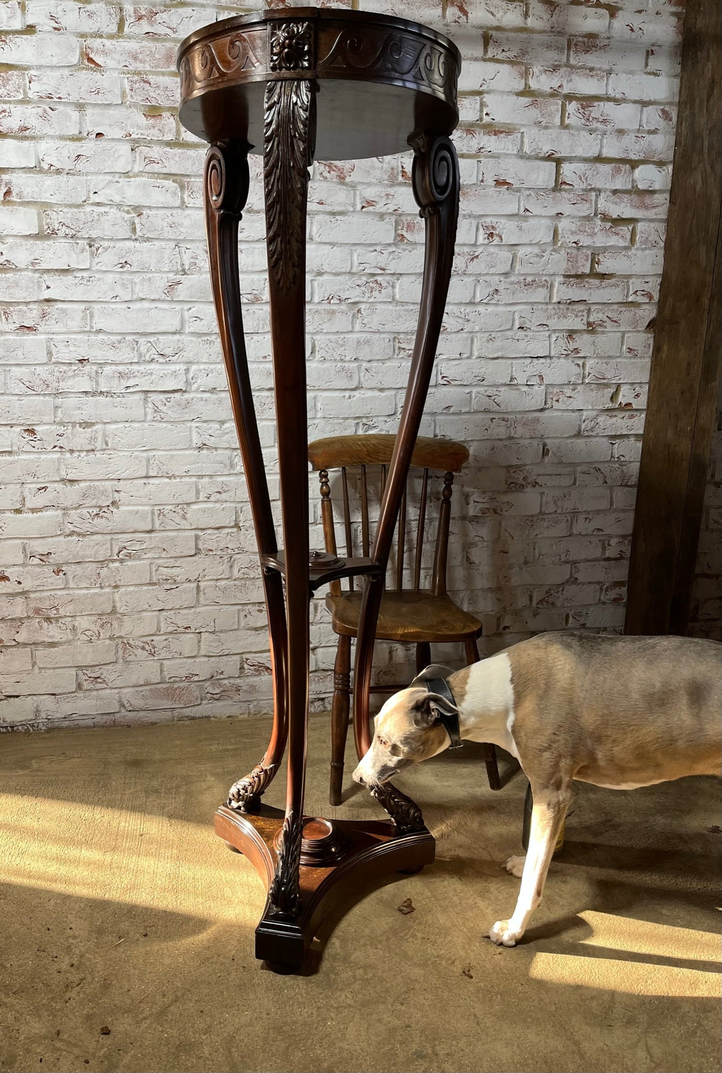 A very large mahogany plant stand, torchere or jardiniere.