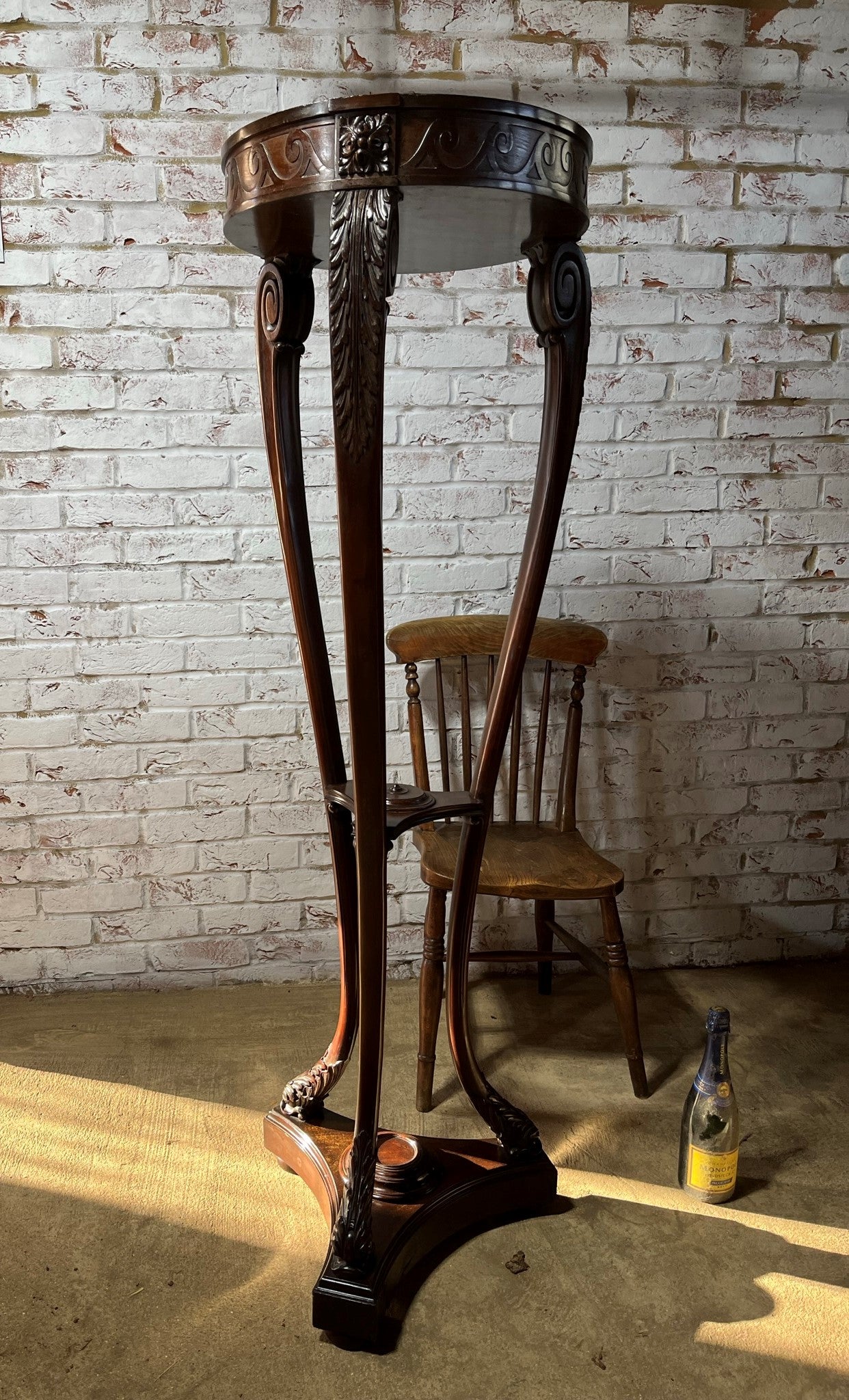 A very large mahogany plant stand, torchere or jardiniere.