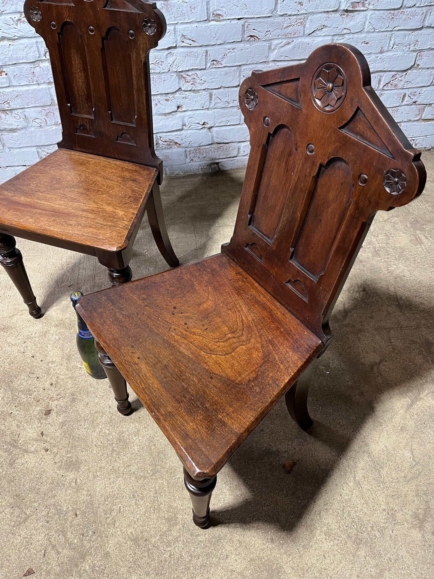 A pair of Gothic hall chairs.