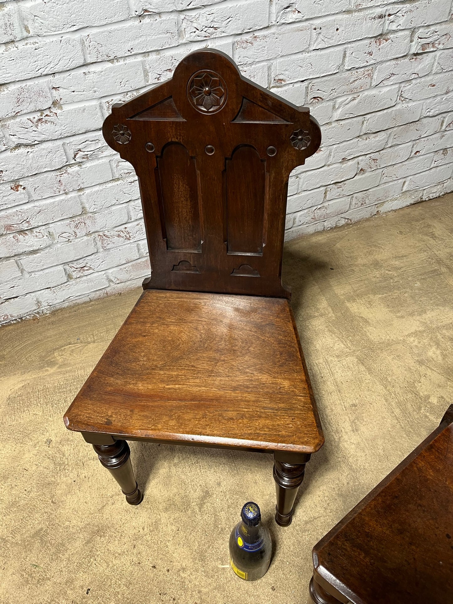 A pair of Gothic hall chairs.