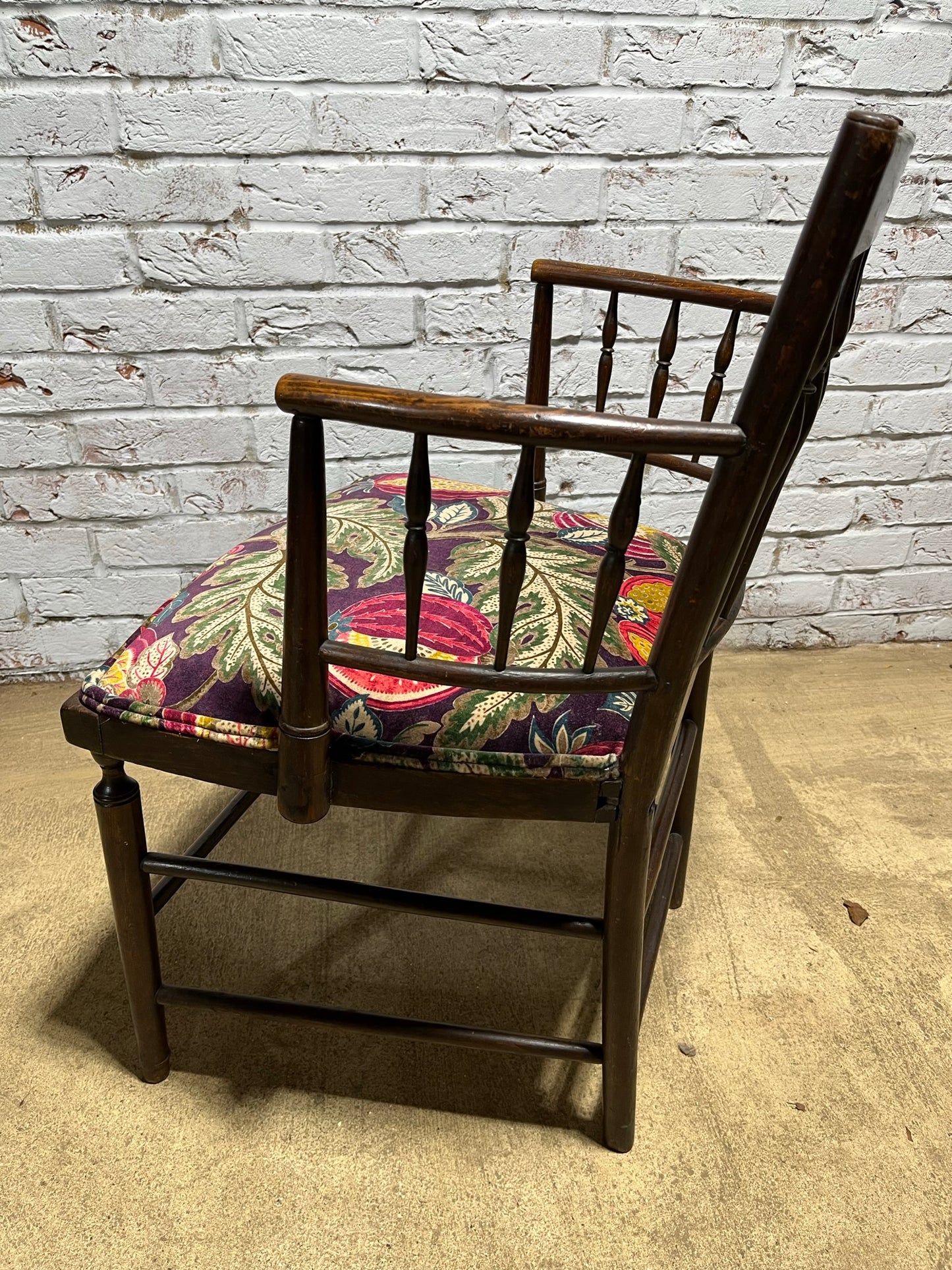 Upholstered Arts & Crafts ‘Sussex’ chair, late 19th/early 20th century, stamped.