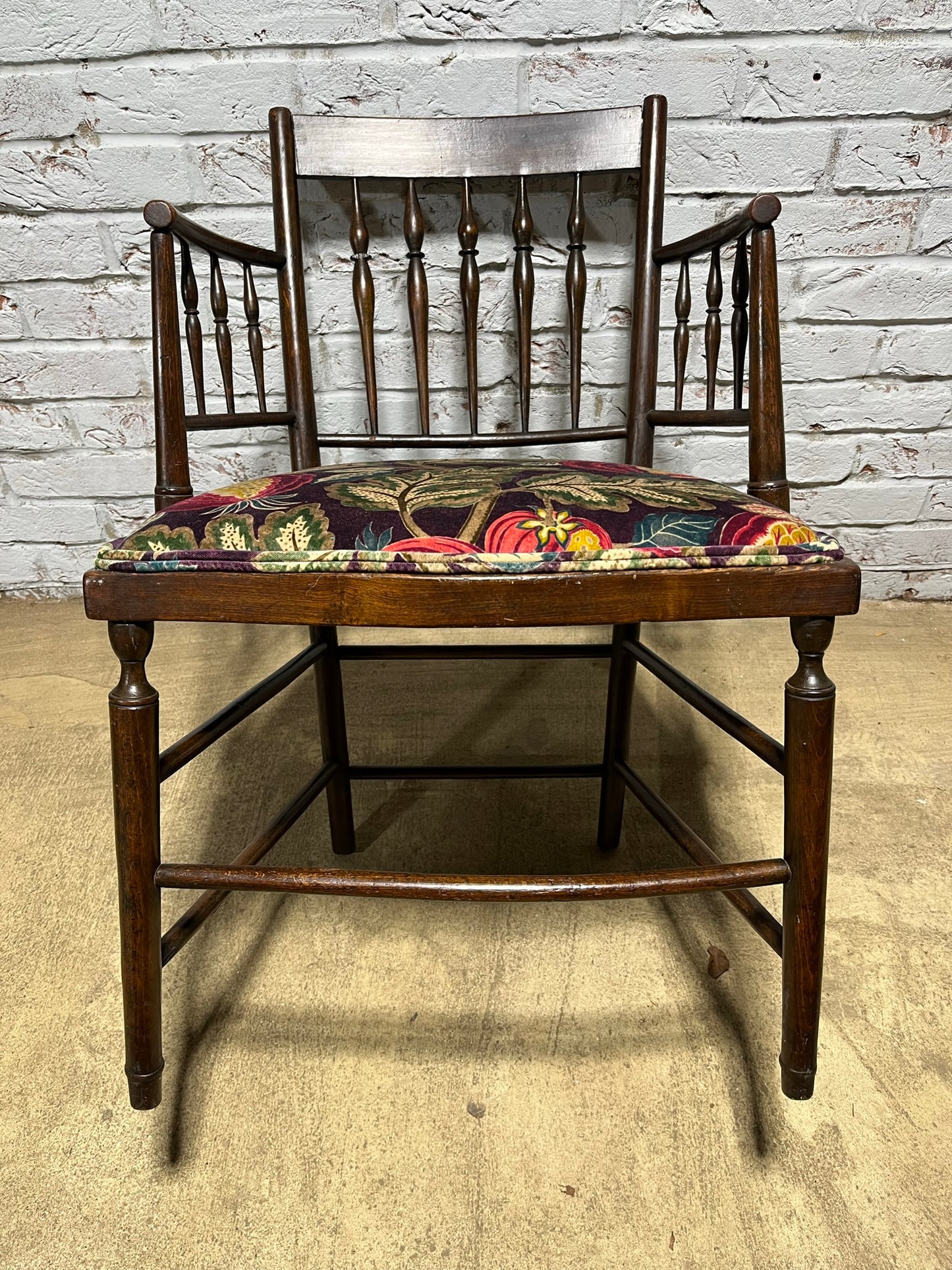 Upholstered Arts & Crafts ‘Sussex’ chair, late 19th/early 20th century, stamped.