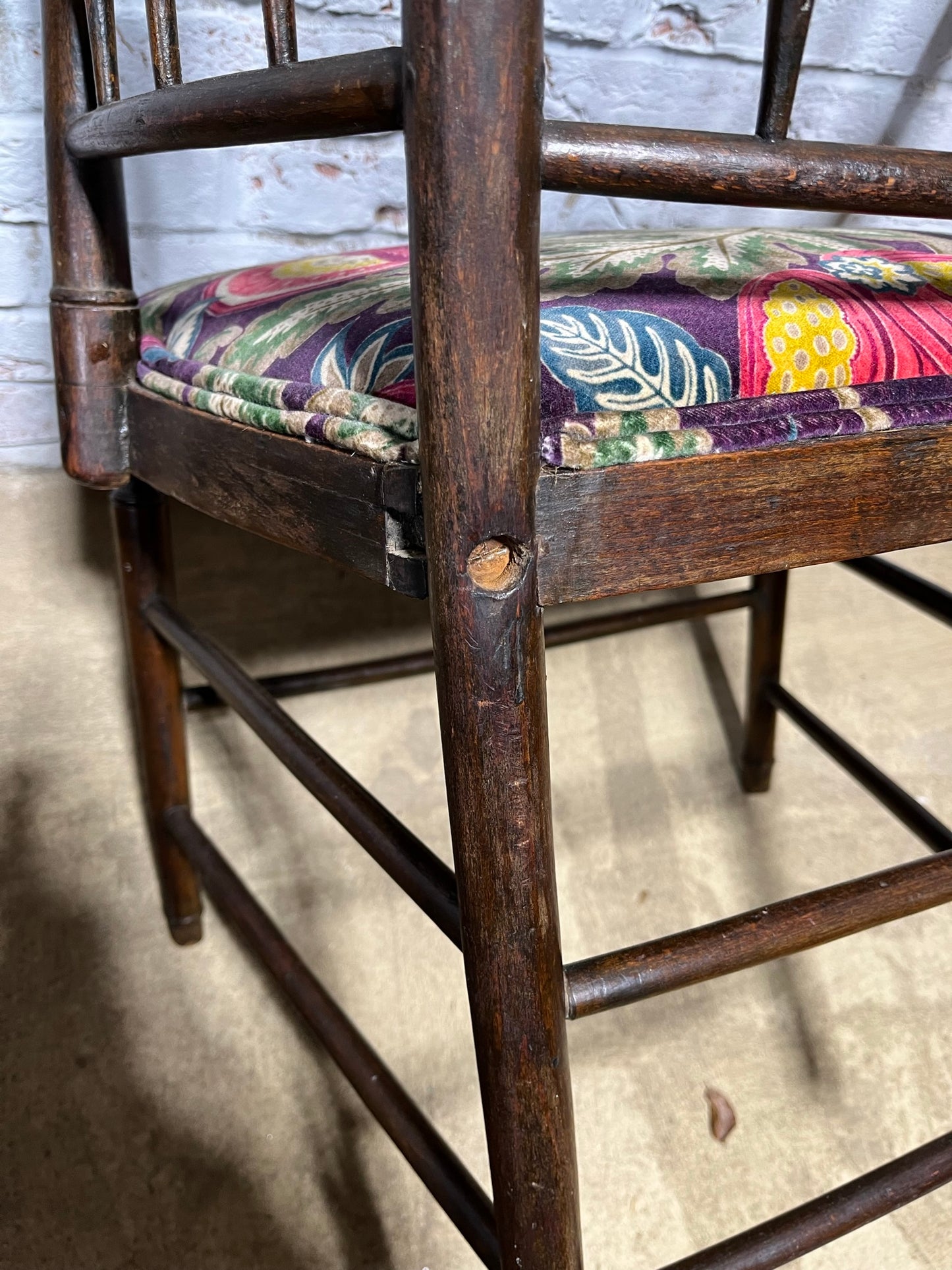 Upholstered Arts & Crafts ‘Sussex’ chair, late 19th/early 20th century, stamped.