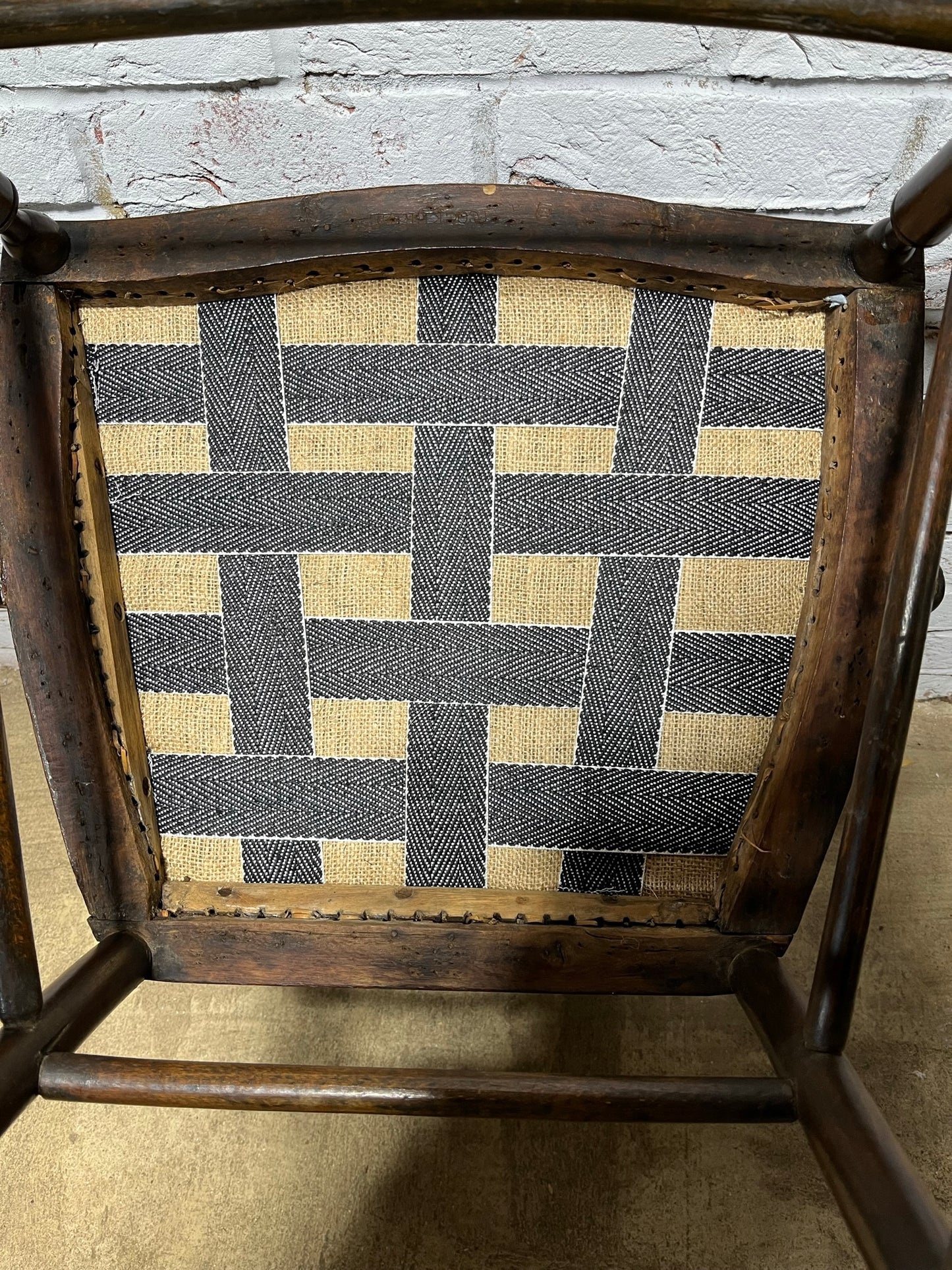 Upholstered Arts & Crafts ‘Sussex’ chair, late 19th/early 20th century, stamped.