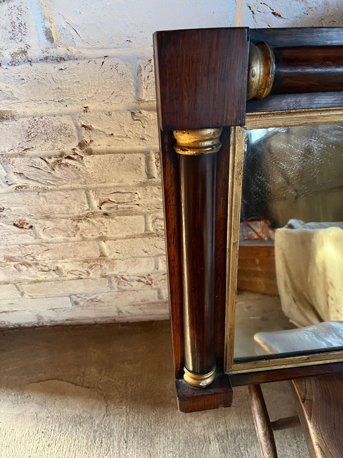 Regency rosewood and gilt overmantle or wall mirror.