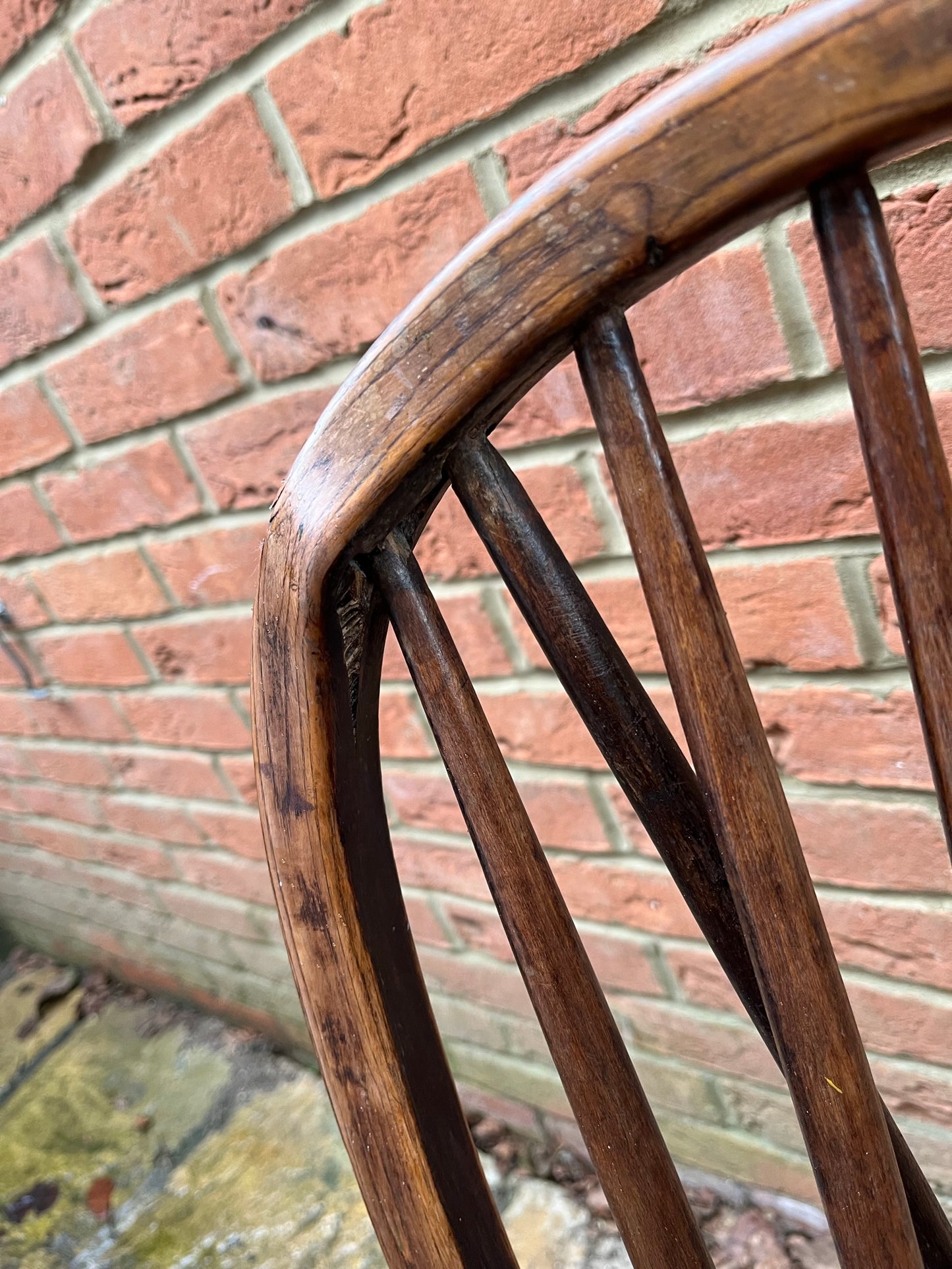 Two 19th century wheel back/stick back kitchen or dining chairs.