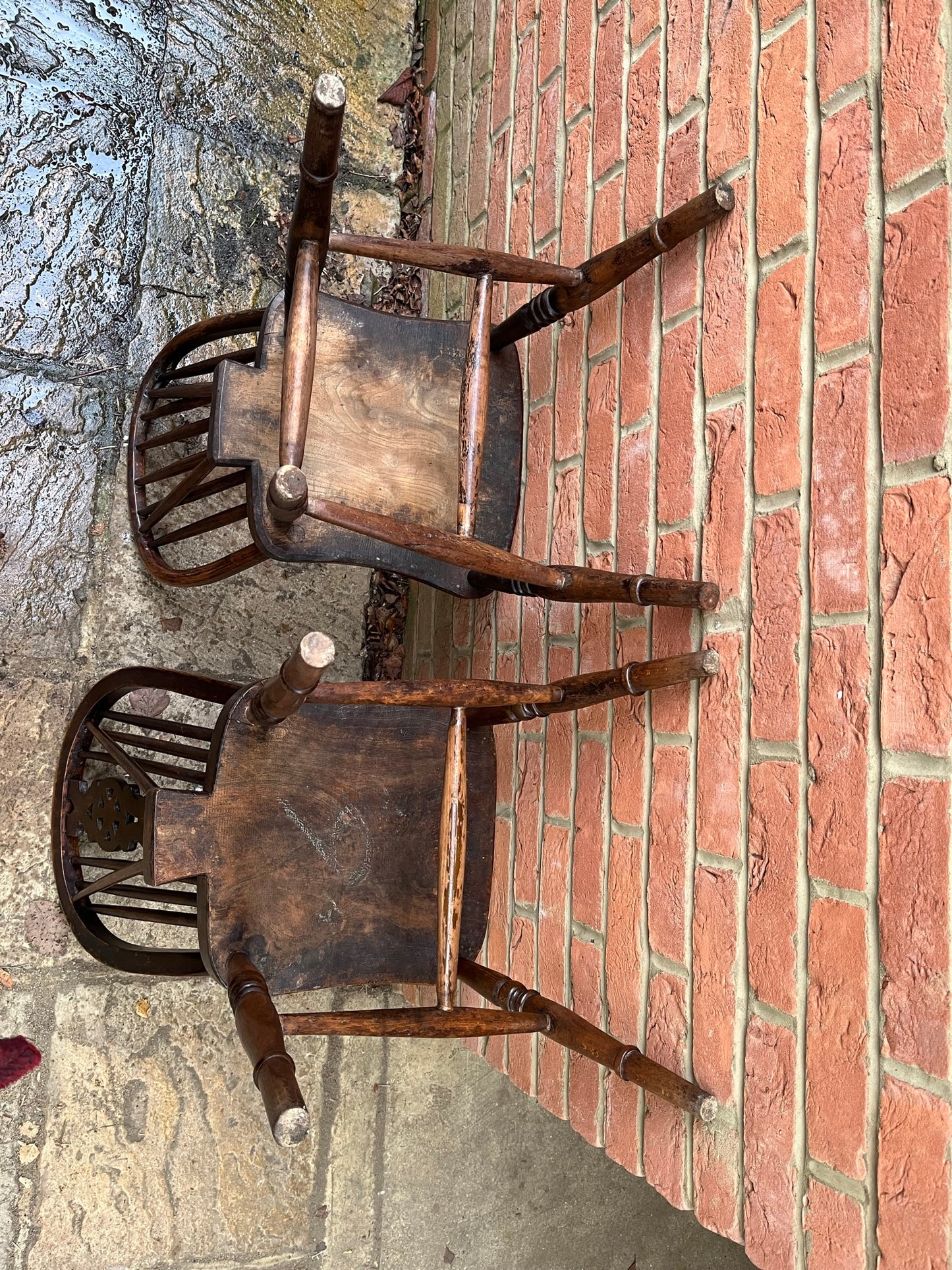 Two 19th century wheel back/stick back kitchen or dining chairs.