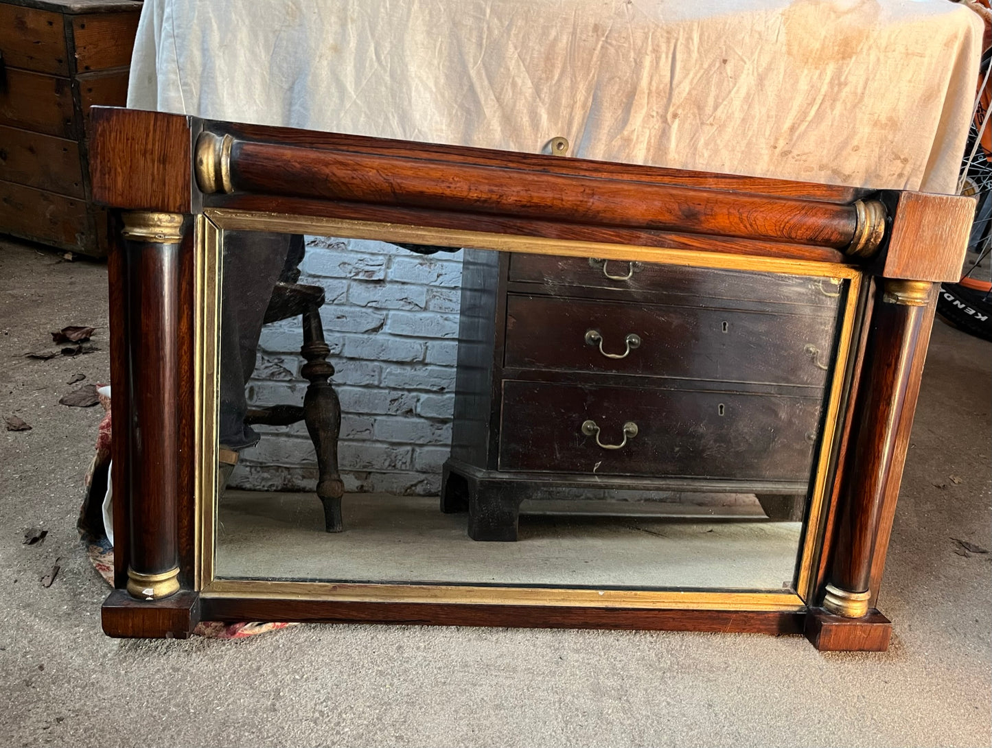 Regency rosewood and gilt overmantle or wall mirror.