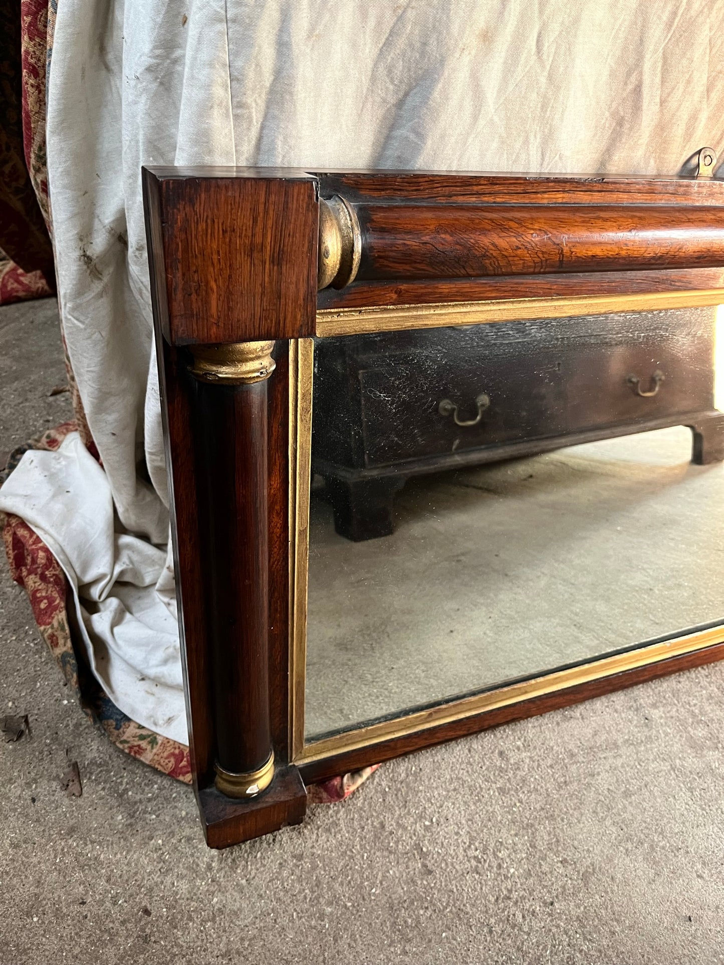 Regency rosewood and gilt overmantle or wall mirror.