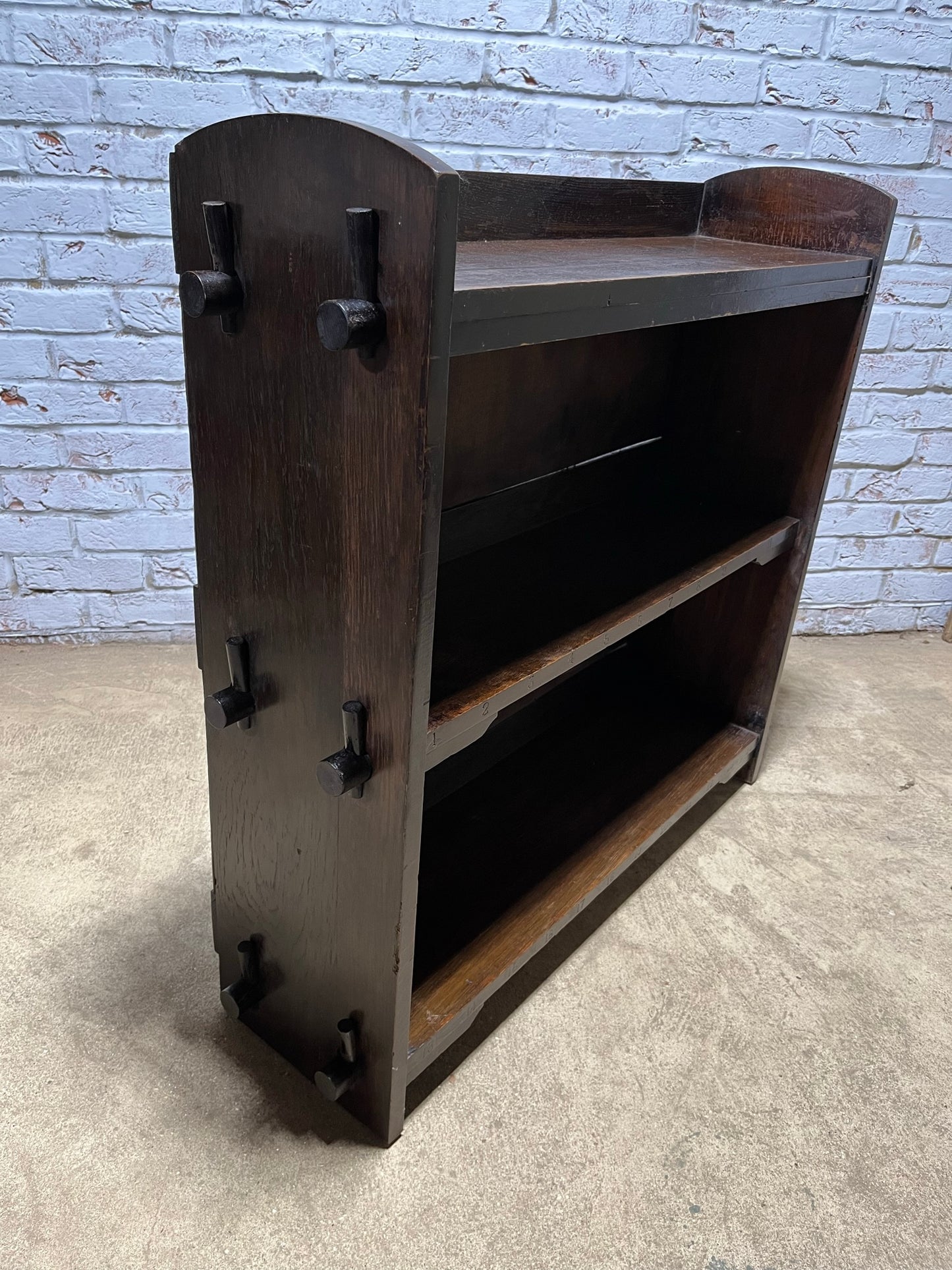 Arts and crafts oak freestanding open bookcase.
