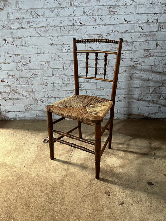 Antique spindle and bobbin back country side chair.